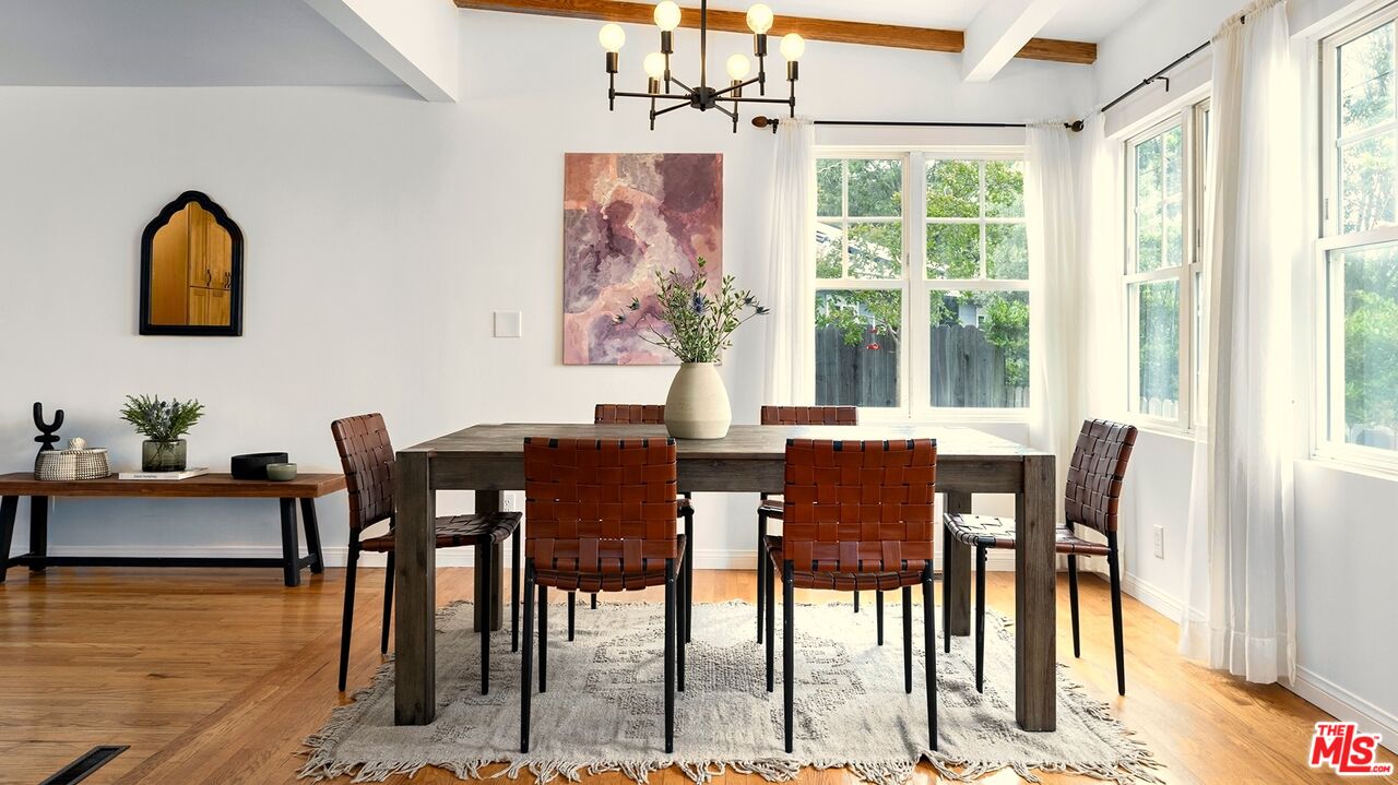 626 Oleander Drive Los Angeles, CA 90042 - Photo 20 of 75 a view of a dining room with furniture window and wooden floor
