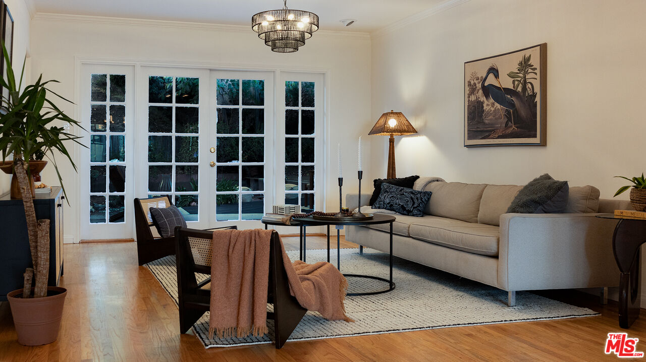 626 Oleander Drive Los Angeles, CA 90042 - Photo 28 of 75 a living room with furniture a table and a large window