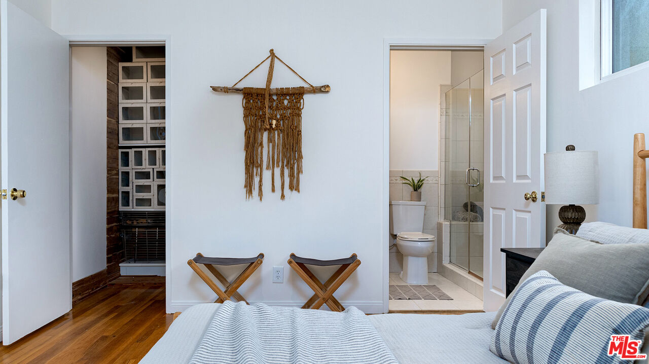 626 Oleander Drive Los Angeles, CA 90042 - Photo 31 of 75 a living room with furniture a rug and a wall painting