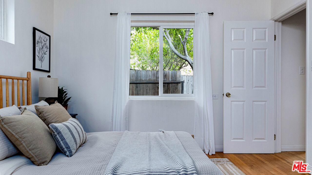 626 Oleander Drive Los Angeles, CA 90042 - Photo 36 of 75 a bed room with a bed and a window