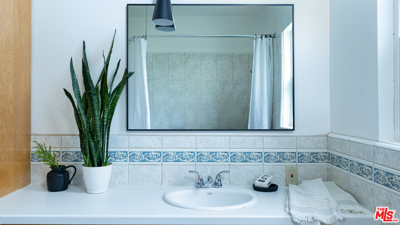 626 Oleander Drive Los Angeles, CA 90042 - Photo 44 of 75 a bathroom with a potted plant
