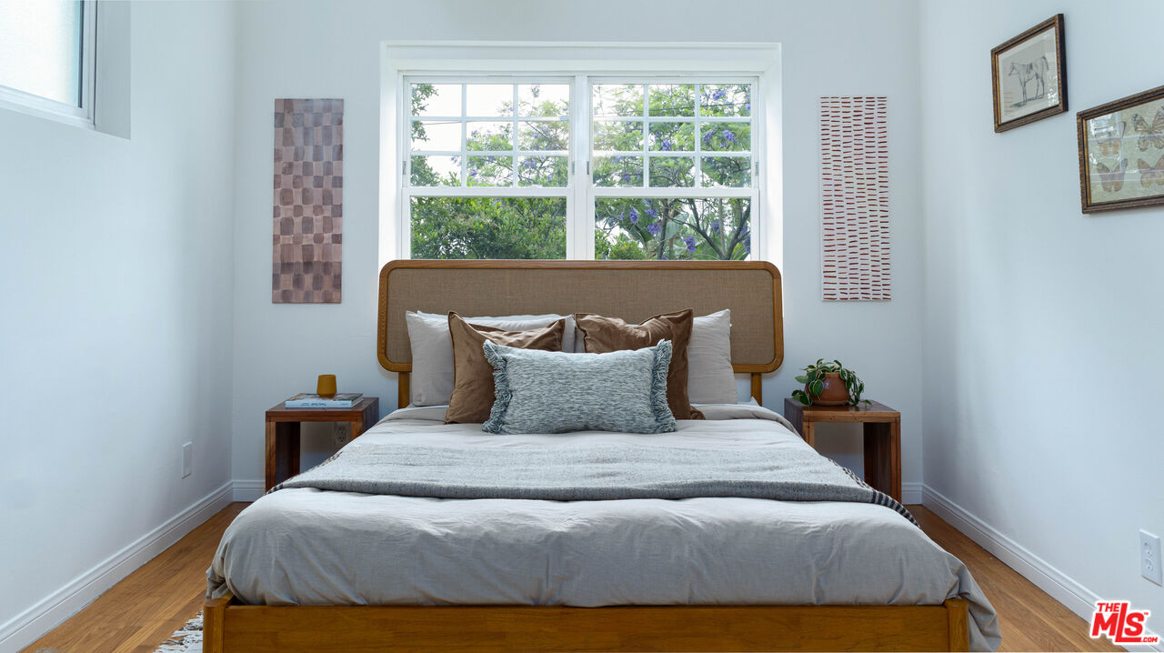 626 Oleander Drive Los Angeles, CA 90042 - Photo 46 of 75 a large bed sitting in a bedroom next to a window