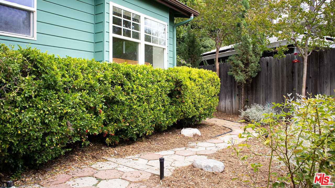 626 Oleander Drive Los Angeles, CA 90042 - Photo 69 of 75 a view of a backyard with potted plants and wooden fence