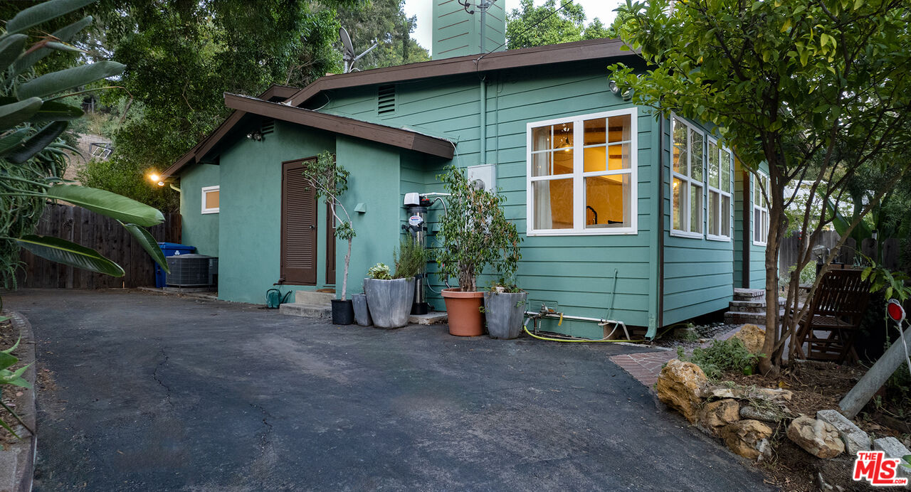 626 Oleander Drive Los Angeles, CA 90042 - Photo 7 of 75 a view of a house with a yard and garage