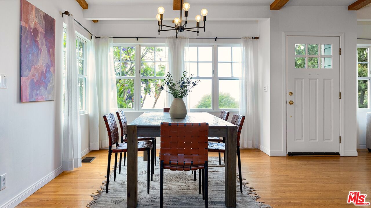 626 Oleander Drive Los Angeles, CA 90042 - Photo 10 of 75 a view of a dining room with furniture window and wooden floor