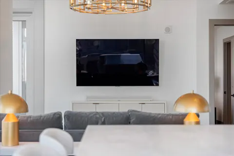 a kitchen with stainless steel appliances granite countertop a sink a stove and a refrigerator