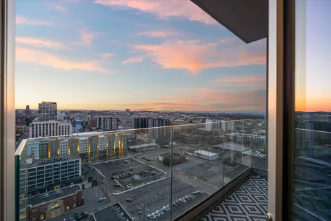 a view of a balcony with city view