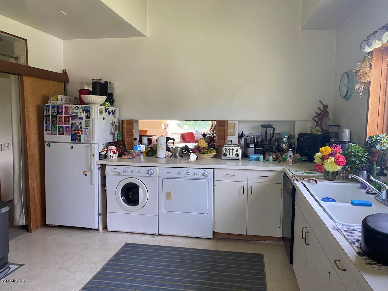 30 Prospect Hill Road Stockbridge, MA 01262 - Photo 7 of 19 a kitchen with a refrigerator and white cabinets