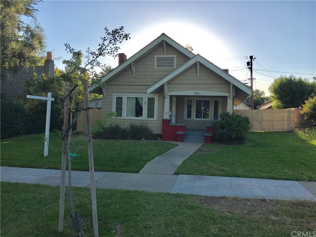 2961 Chestnut Street Riverside, CA 92501 - Photo 1 of 1 a front view of a house with a garden