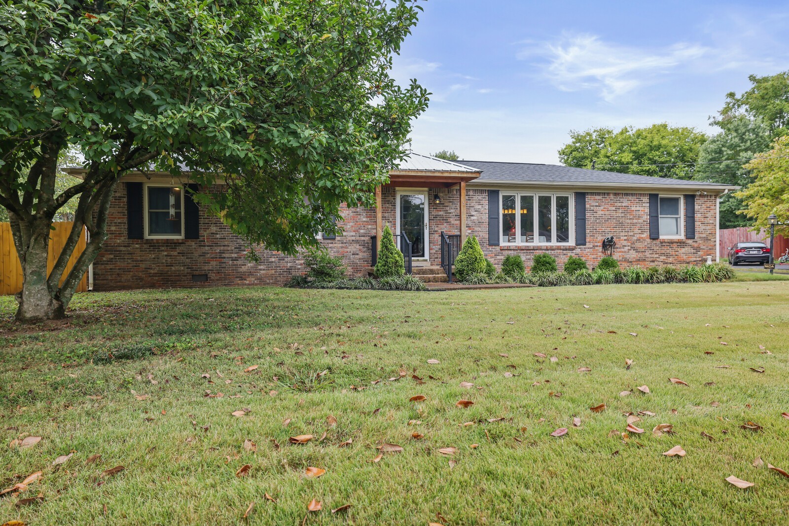 a front view of house with yard and green space