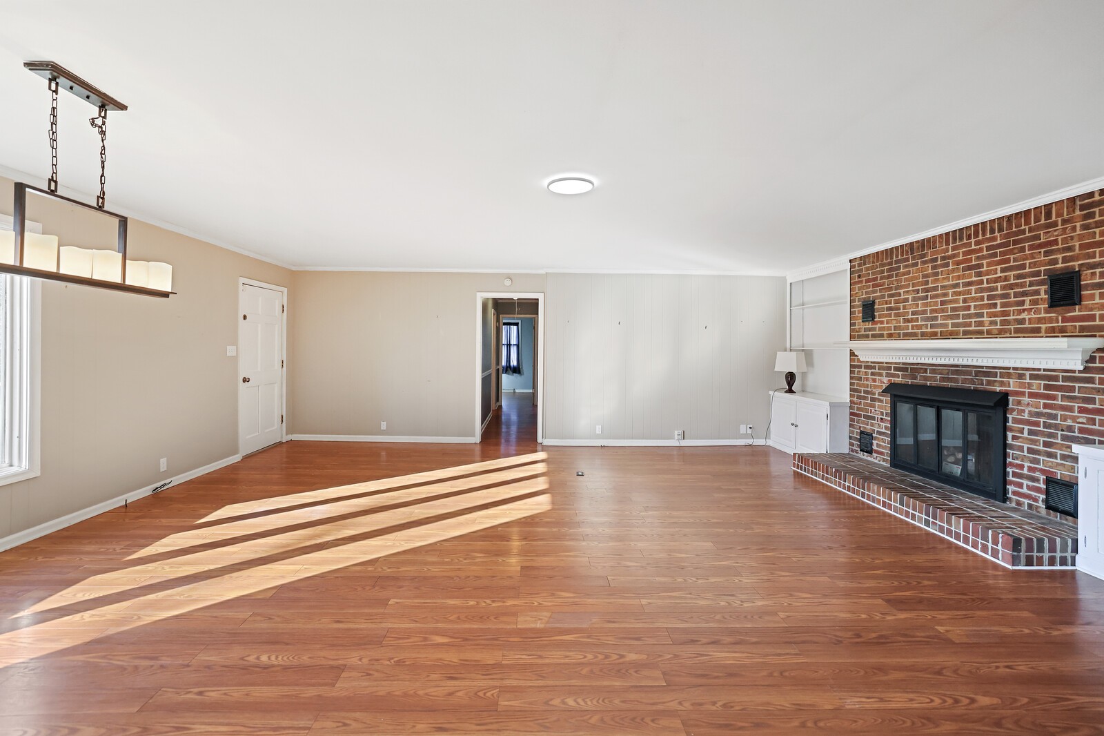 220 Hampton Road Columbia, TN 38401 - Photo 12 of 74 a view of empty room with wooden floor and fireplace