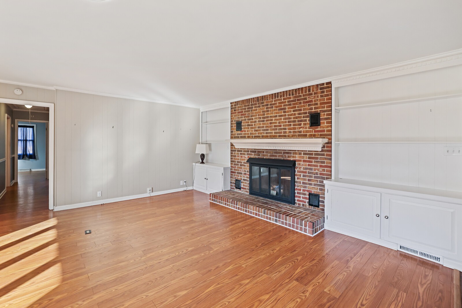220 Hampton Road Columbia, TN 38401 - Photo 13 of 74 a view of empty room with wooden floor and fireplace