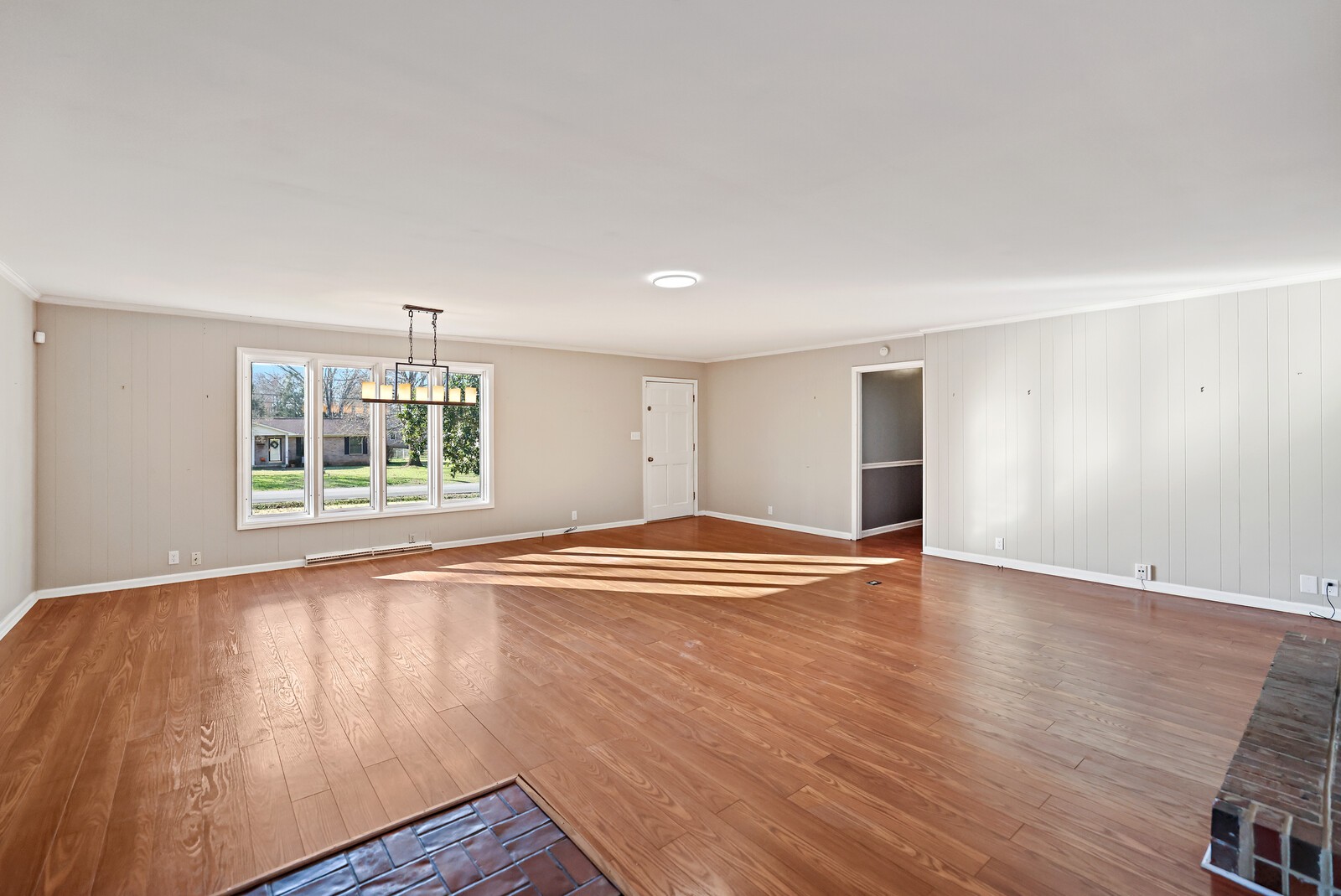 220 Hampton Road Columbia, TN 38401 - Photo 15 of 74 an empty room with wooden floor and windows