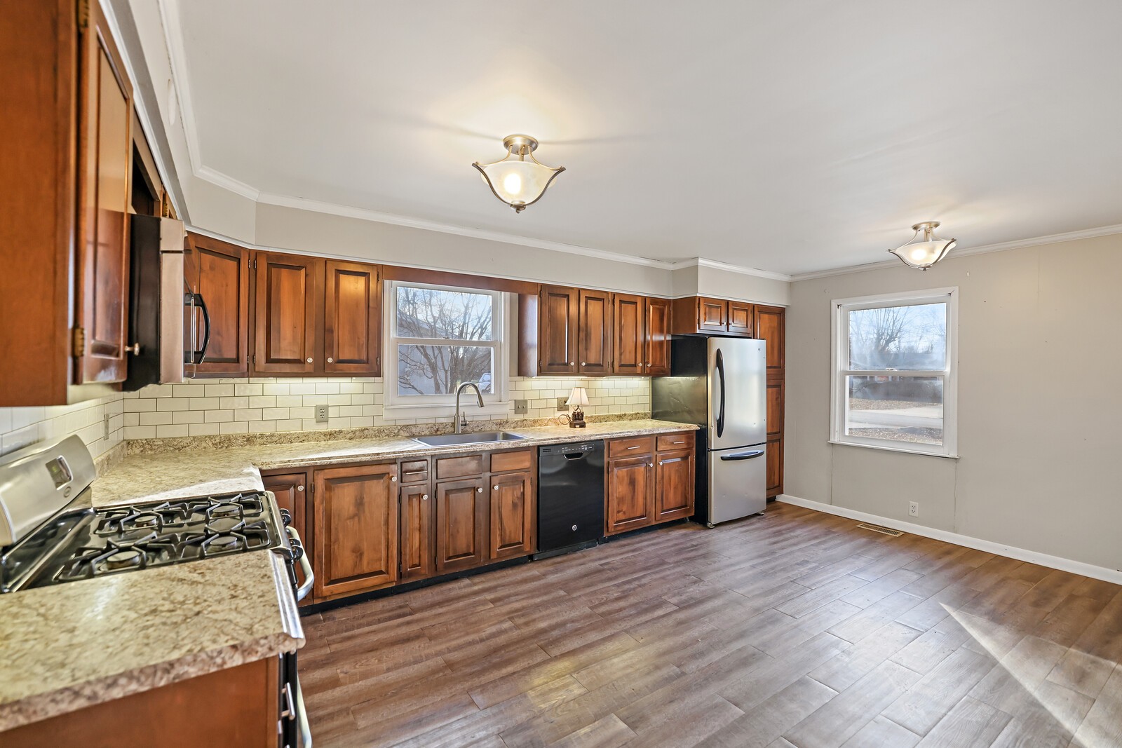 220 Hampton Road Columbia, TN 38401 - Photo 19 of 74 a large kitchen with stainless steel appliances granite countertop a stove a sink dishwasher and a oven with wooden floors