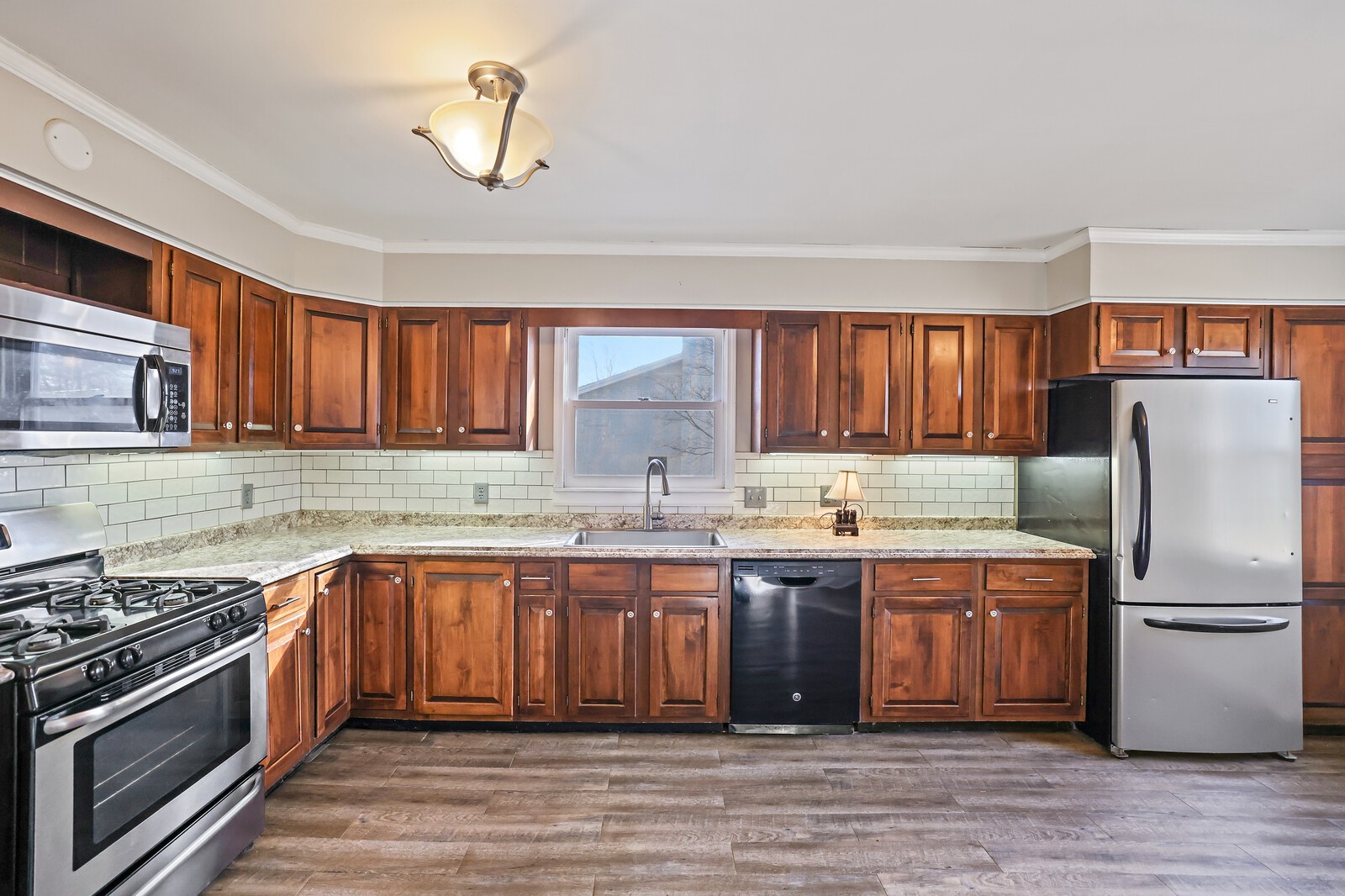 220 Hampton Road Columbia, TN 38401 - Photo 20 of 74 a kitchen with stainless steel appliances granite countertop a sink stove and refrigerator