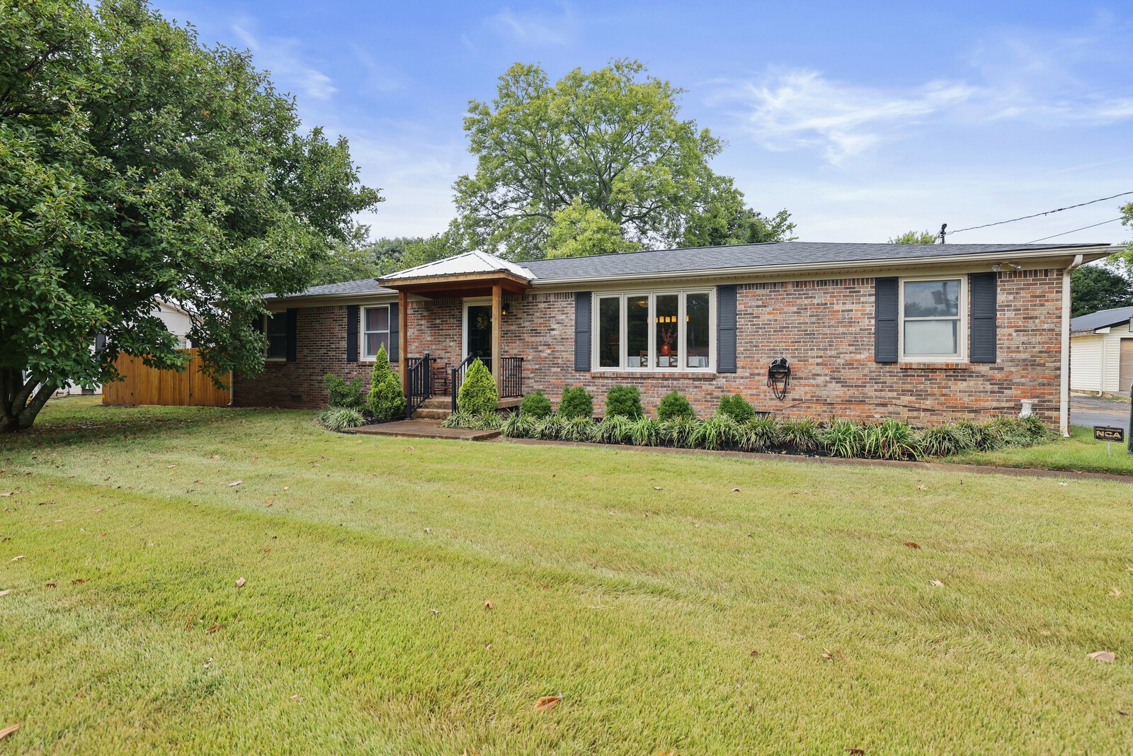 220 Hampton Road Columbia, TN 38401 - Photo 2 of 74 a front view of house with yard and trees around