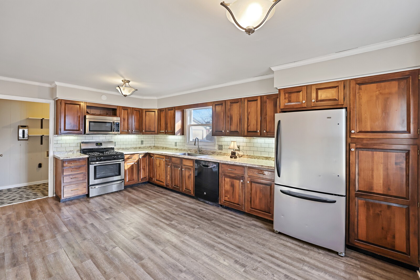 220 Hampton Road Columbia, TN 38401 - Photo 21 of 74 a kitchen with stainless steel appliances granite countertop a refrigerator stove a sink dishwasher and a oven with wooden floor