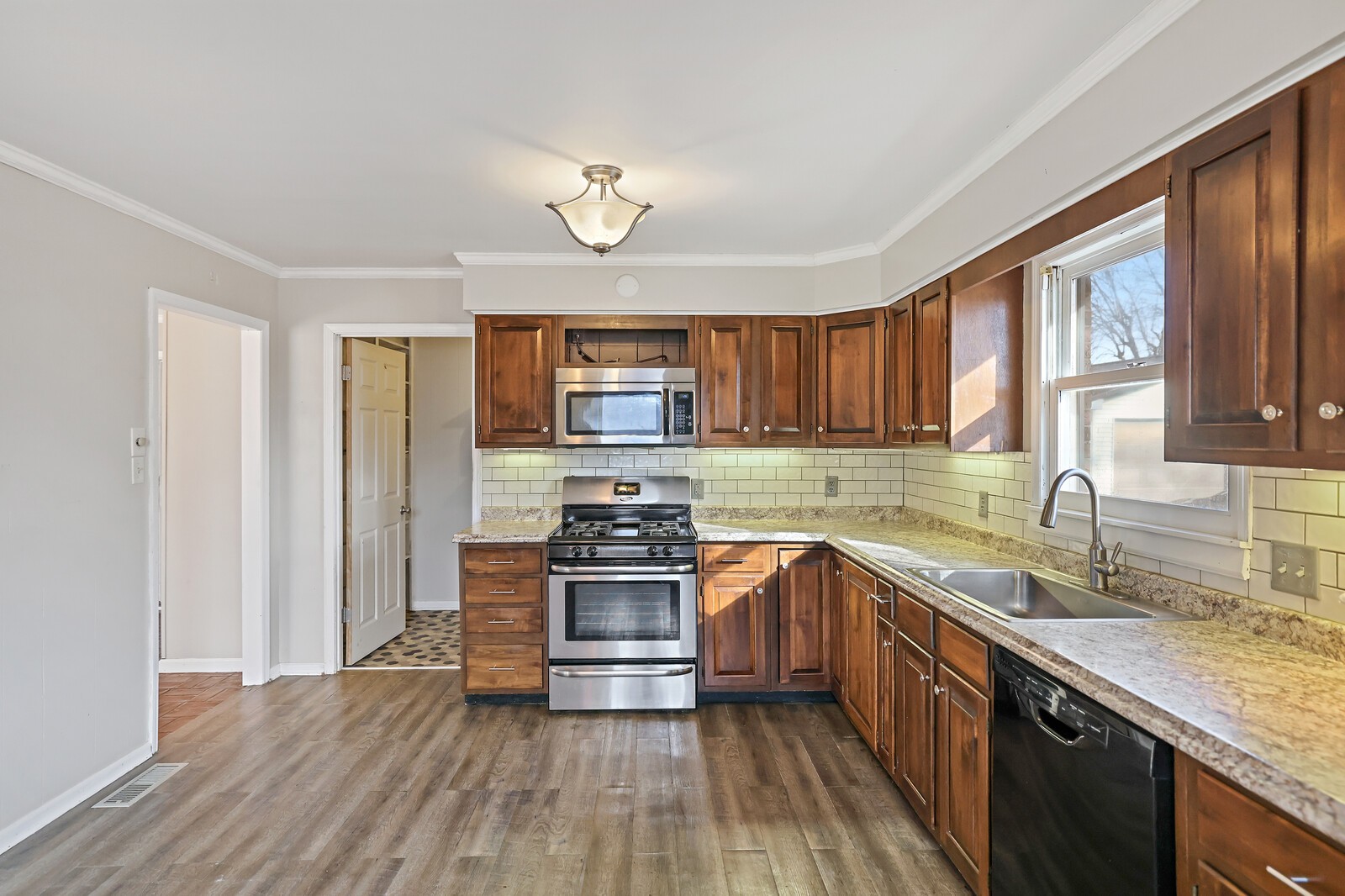 220 Hampton Road Columbia, TN 38401 - Photo 23 of 74 a kitchen with stainless steel appliances granite countertop hardwood floor sink stove and granite counter top