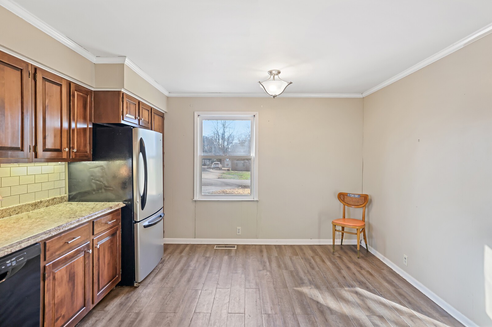 220 Hampton Road Columbia, TN 38401 - Photo 24 of 74 a kitchen with stainless steel appliances granite countertop a refrigerator a sink dishwasher a stove and white countertops with wooden floor