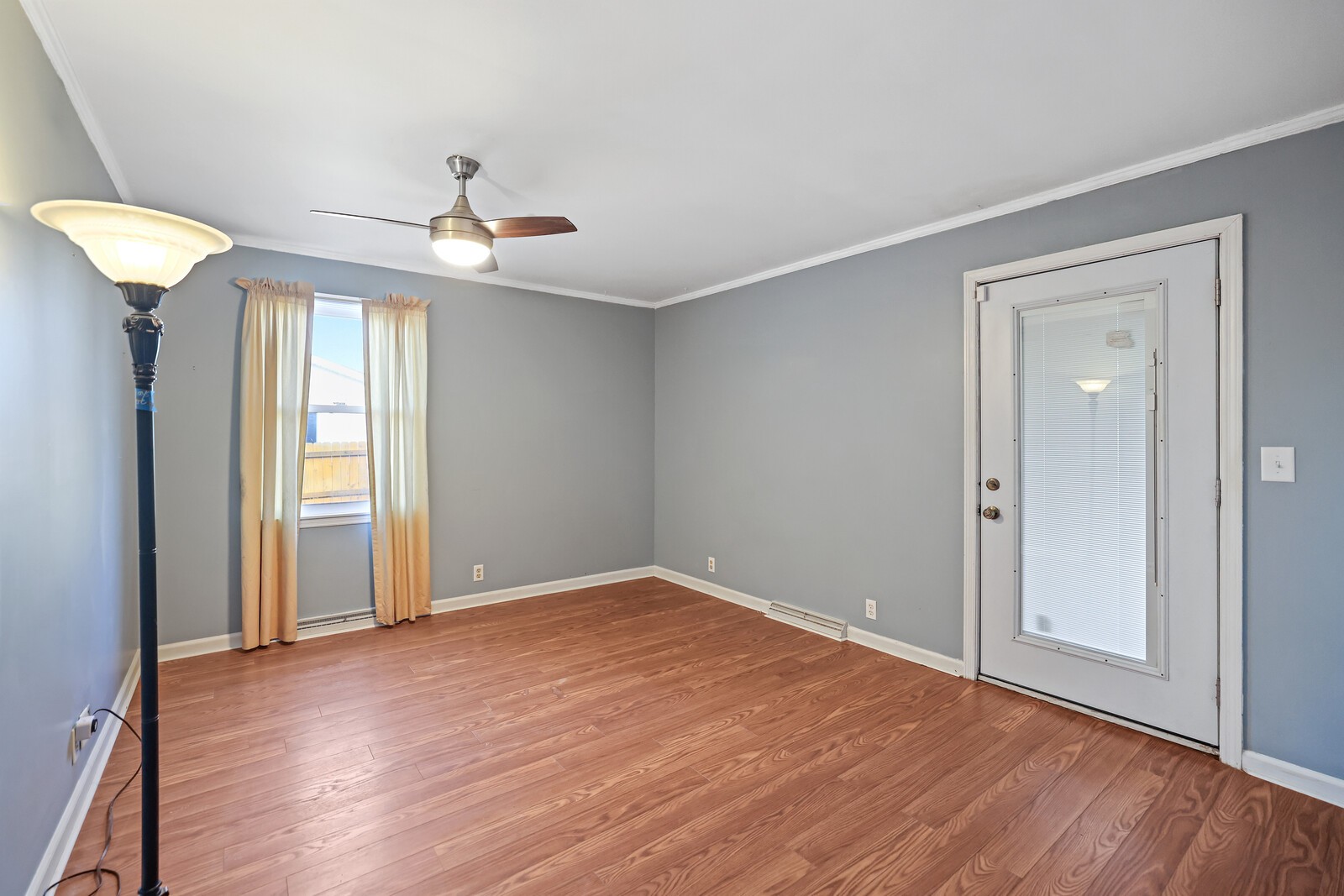 220 Hampton Road Columbia, TN 38401 - Photo 36 of 74 an empty room with wooden floor chandelier fan and windows