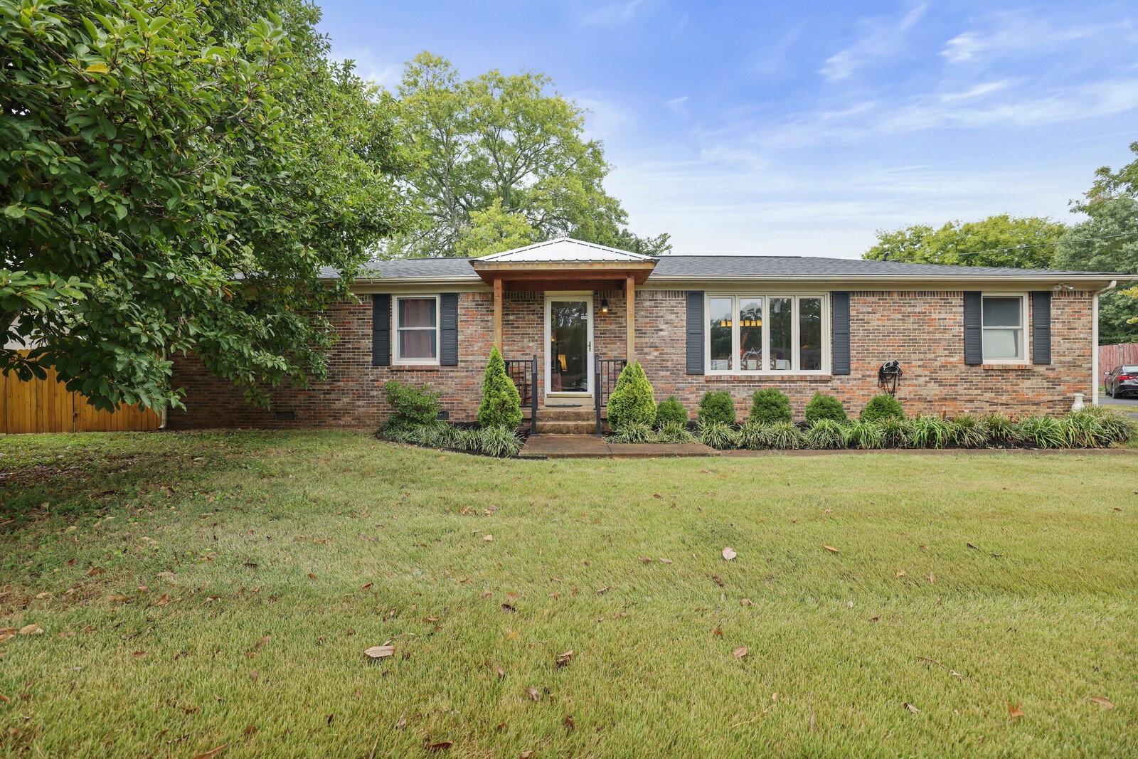 220 Hampton Road Columbia, TN 38401 - Photo 5 of 74 a front view of house with yard and trees around