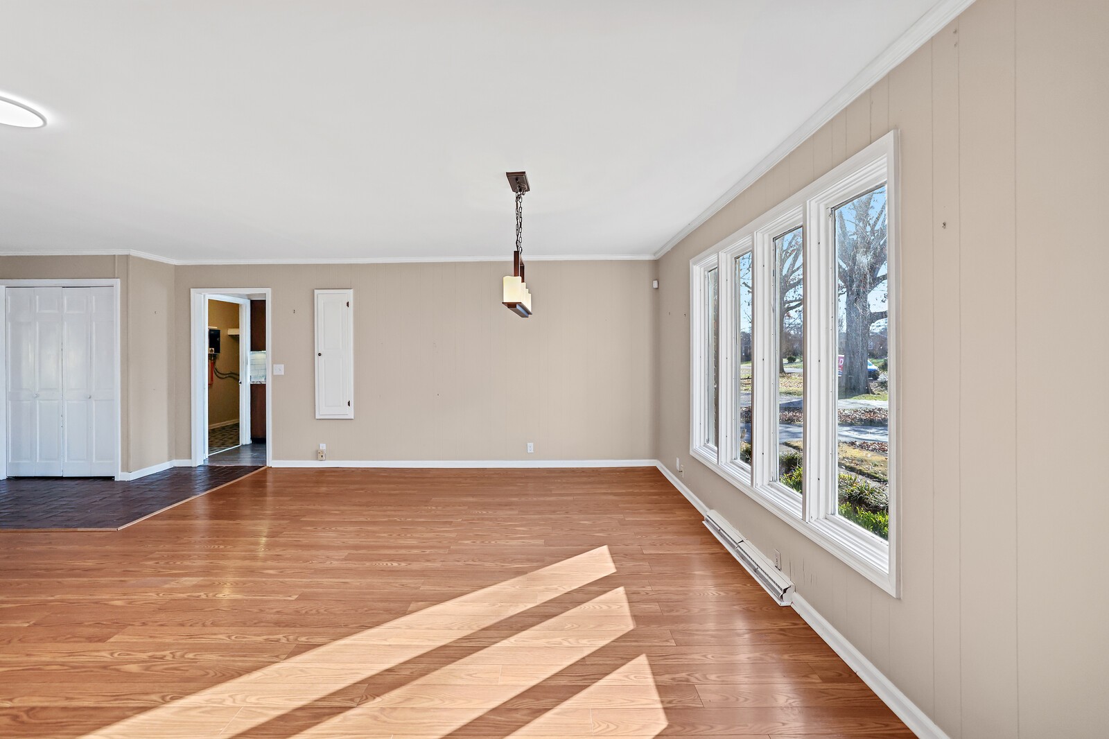 220 Hampton Road Columbia, TN 38401 - Photo 7 of 74 a view of an empty room with wooden floor and a window