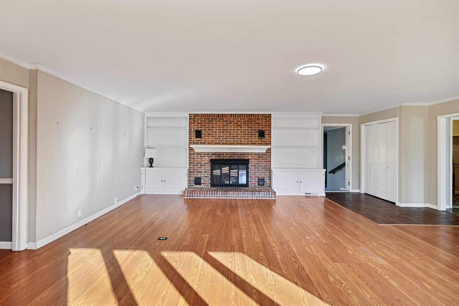 220 Hampton Road Columbia, TN 38401 - Photo 10 of 74 a view of an empty room with wooden floor fireplace and a window
