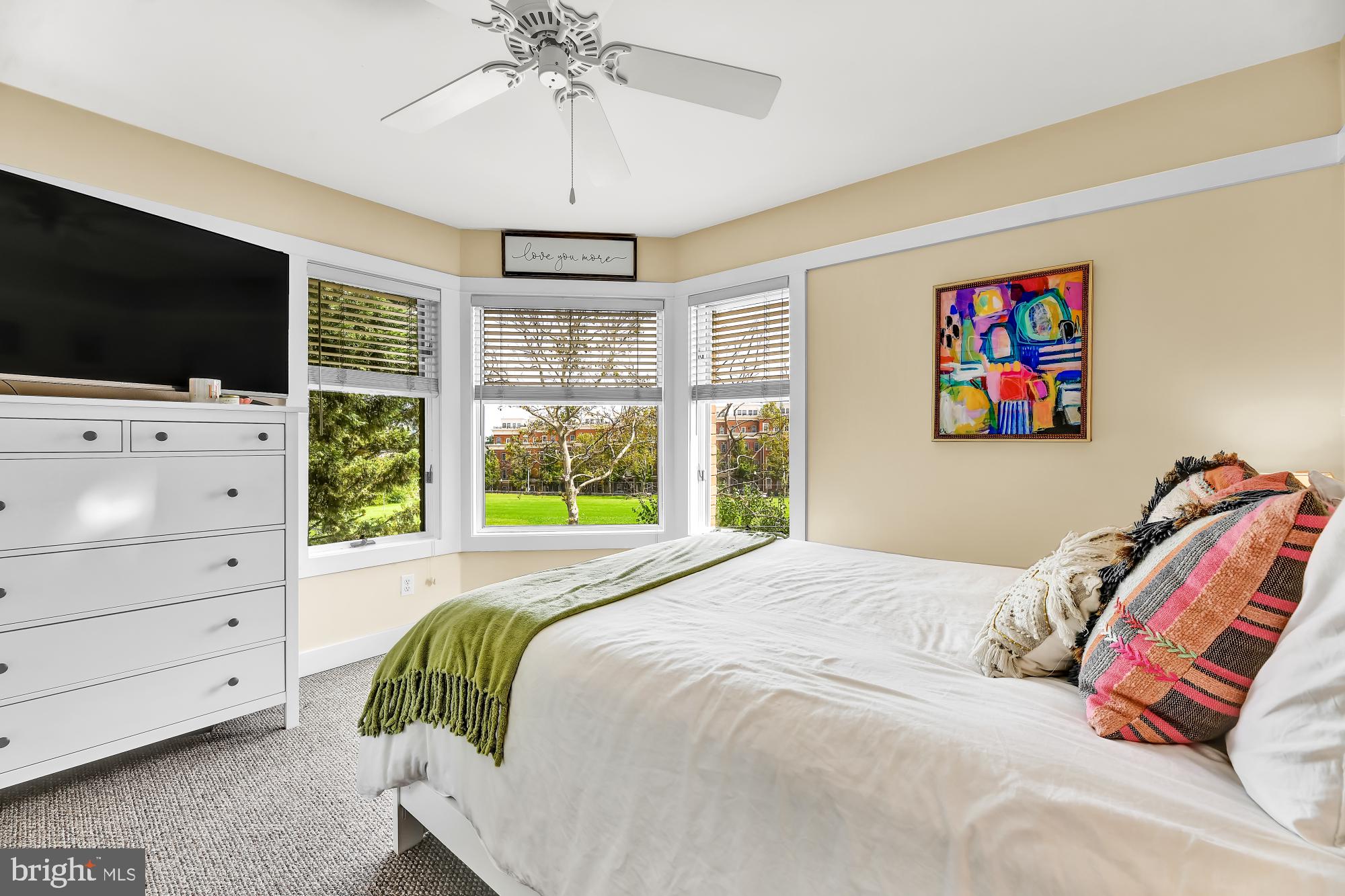 1257 Riverside Avenue, Unit D Baltimore, MD 21230 - Photo 12 of 36 a bedroom with a bed and a flat screen tv