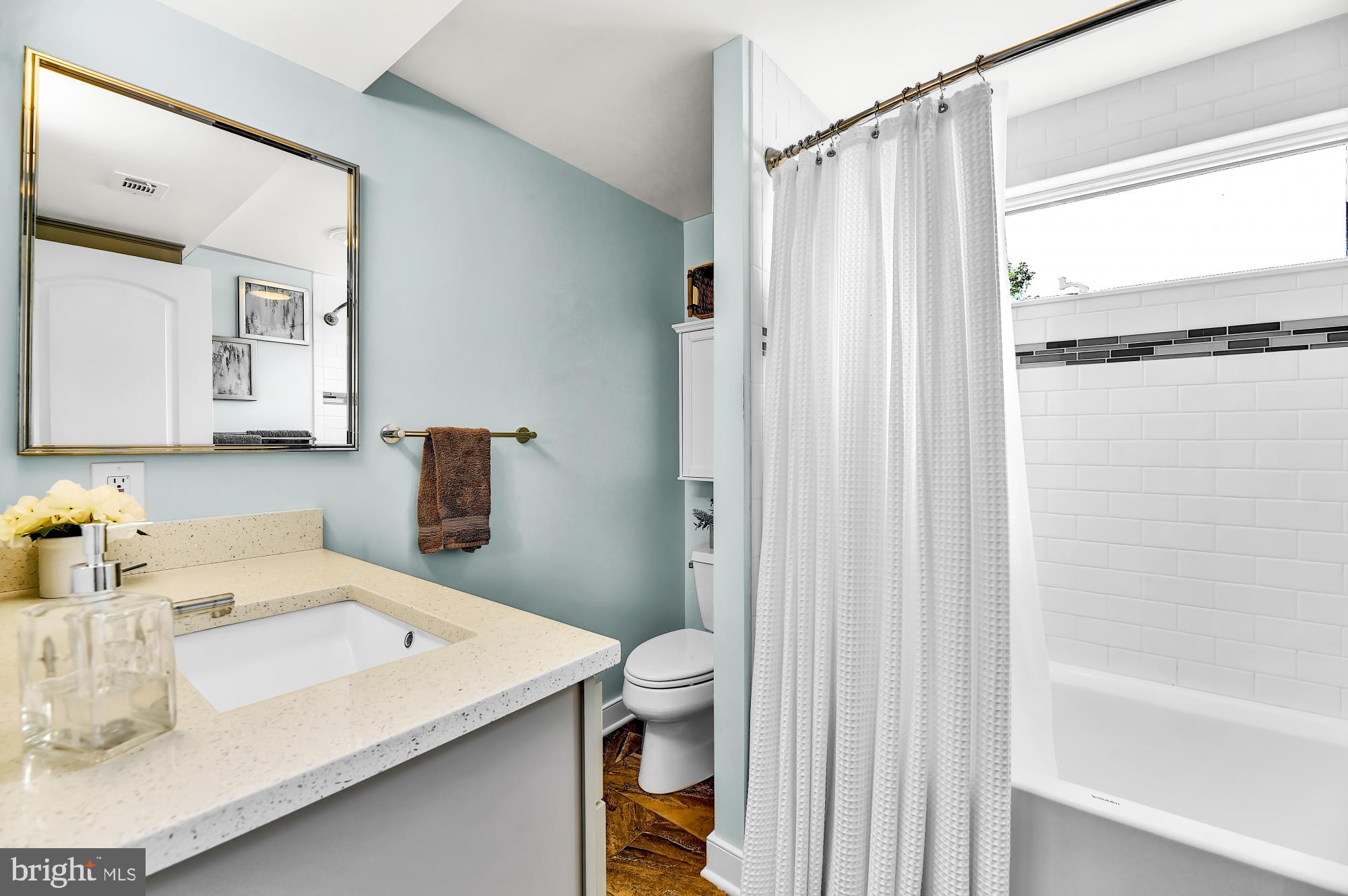 1257 Riverside Avenue, Unit D Baltimore, MD 21230 - Photo 16 of 36 a bathroom with a sink a toilet and shower