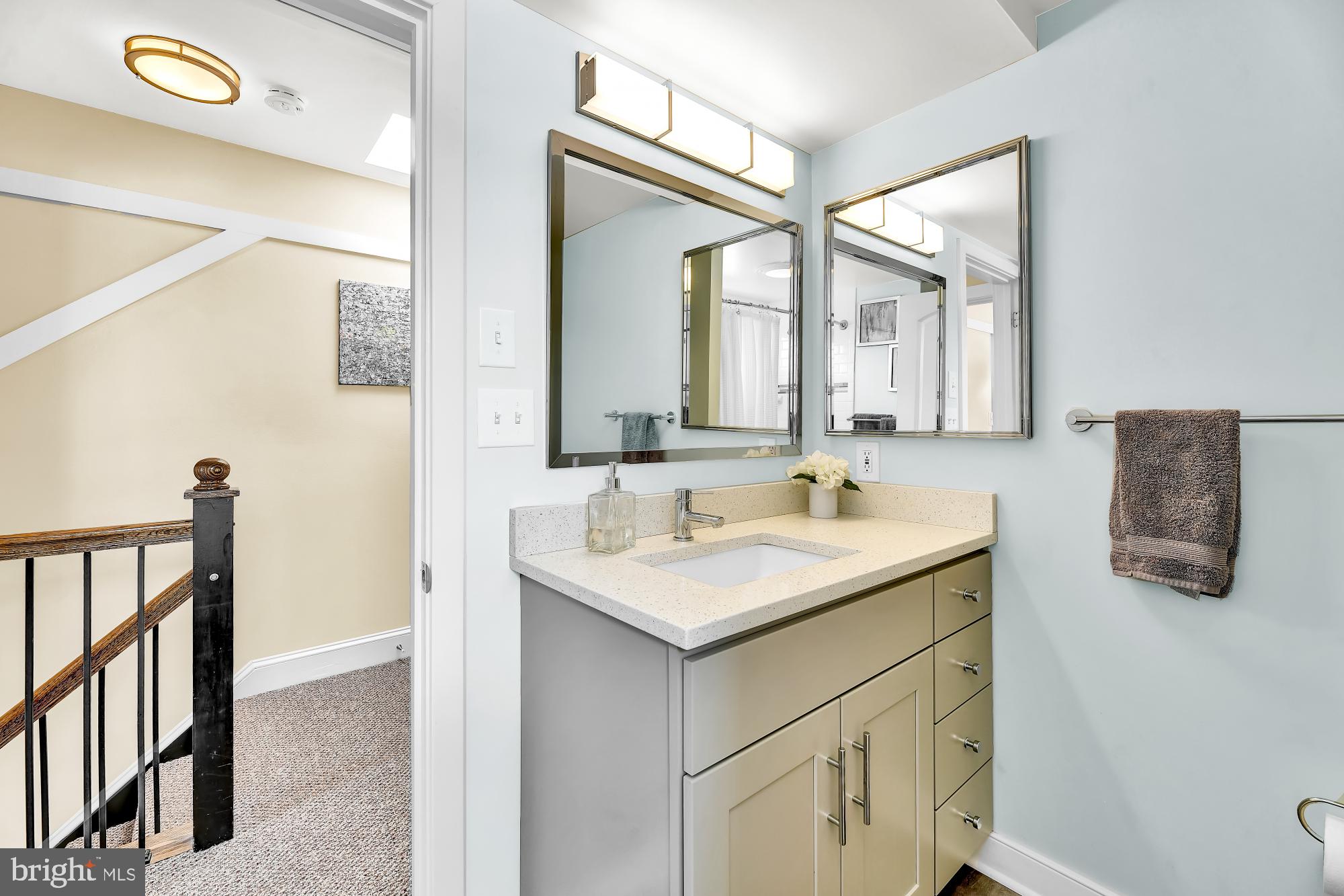 1257 Riverside Avenue, Unit D Baltimore, MD 21230 - Photo 17 of 36 a bathroom with a sink vanity and a mirror