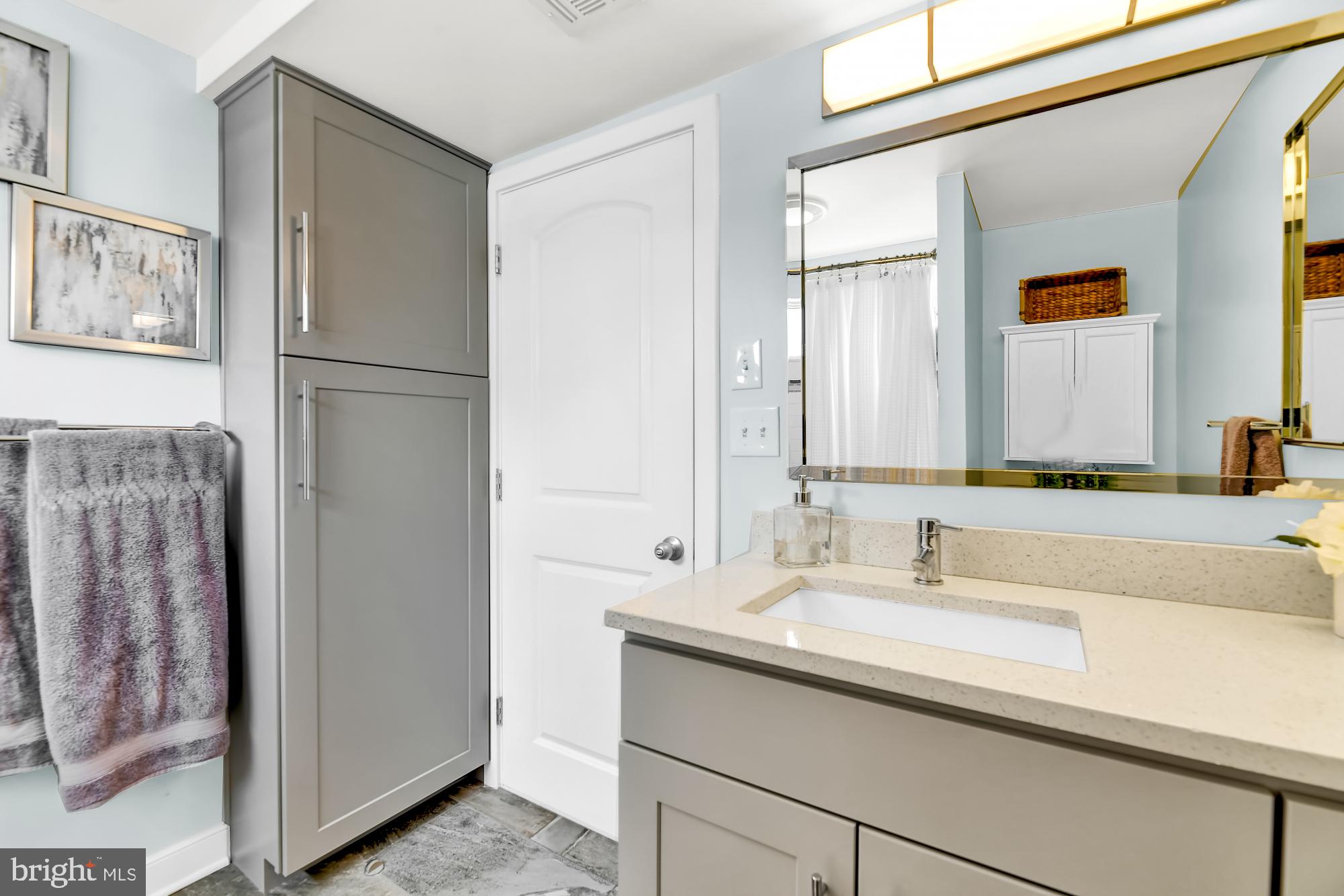1257 Riverside Avenue, Unit D Baltimore, MD 21230 - Photo 18 of 36 a bathroom with a sink and a mirror
