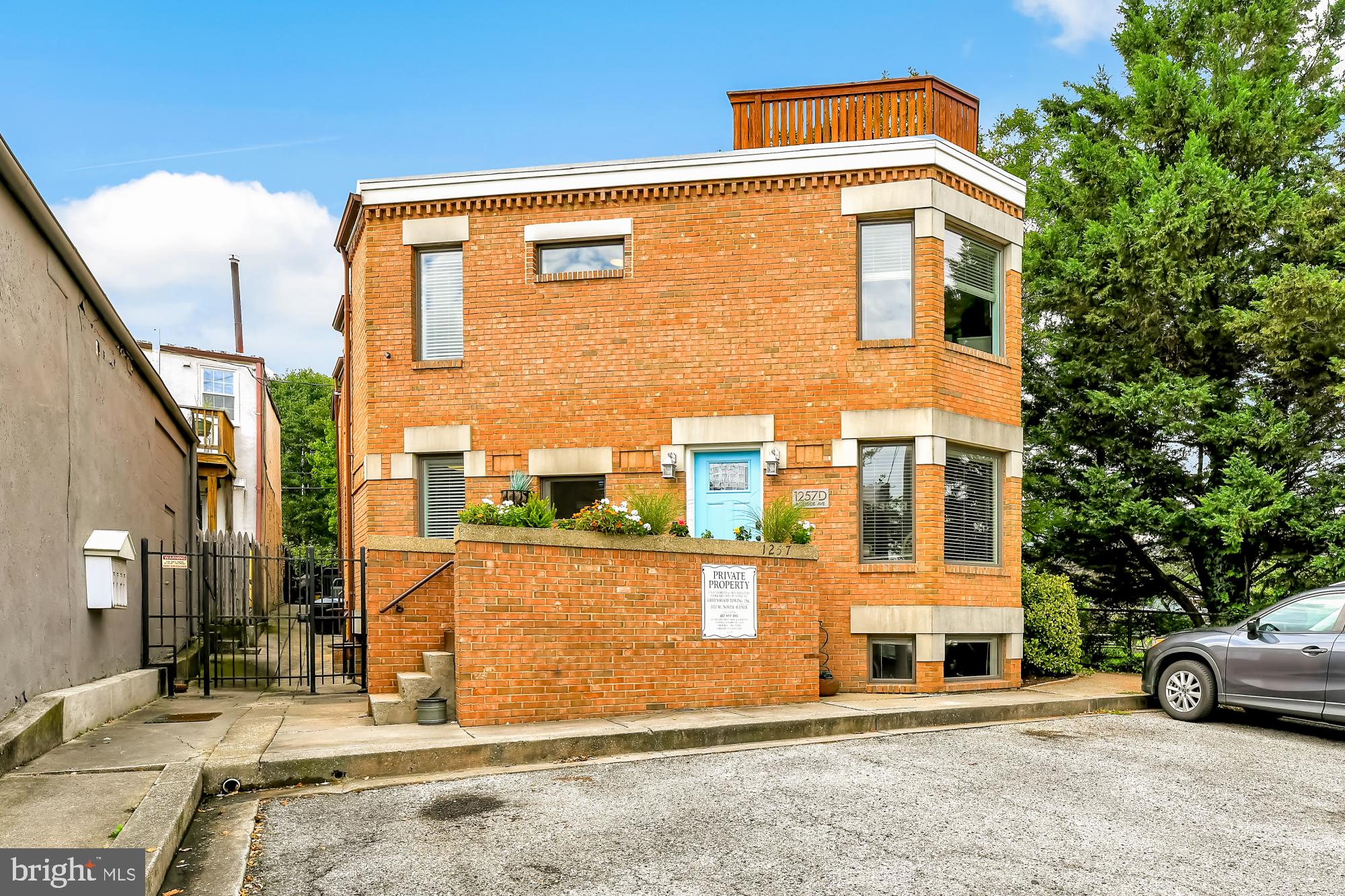 1257 Riverside Avenue, Unit D Baltimore, MD 21230 - Photo 3 of 36 a front view of a house with parking