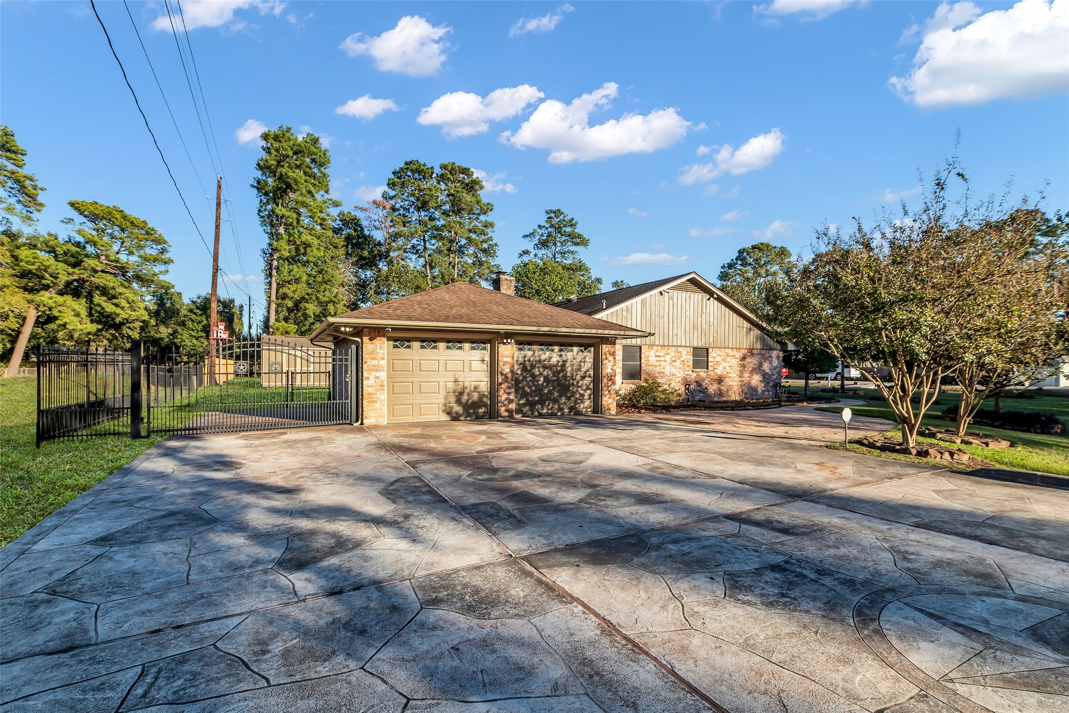603 St Andrews Road Kingwood, TX 77339 - Photo 1 of 34 a front view of a house with a yard and garage