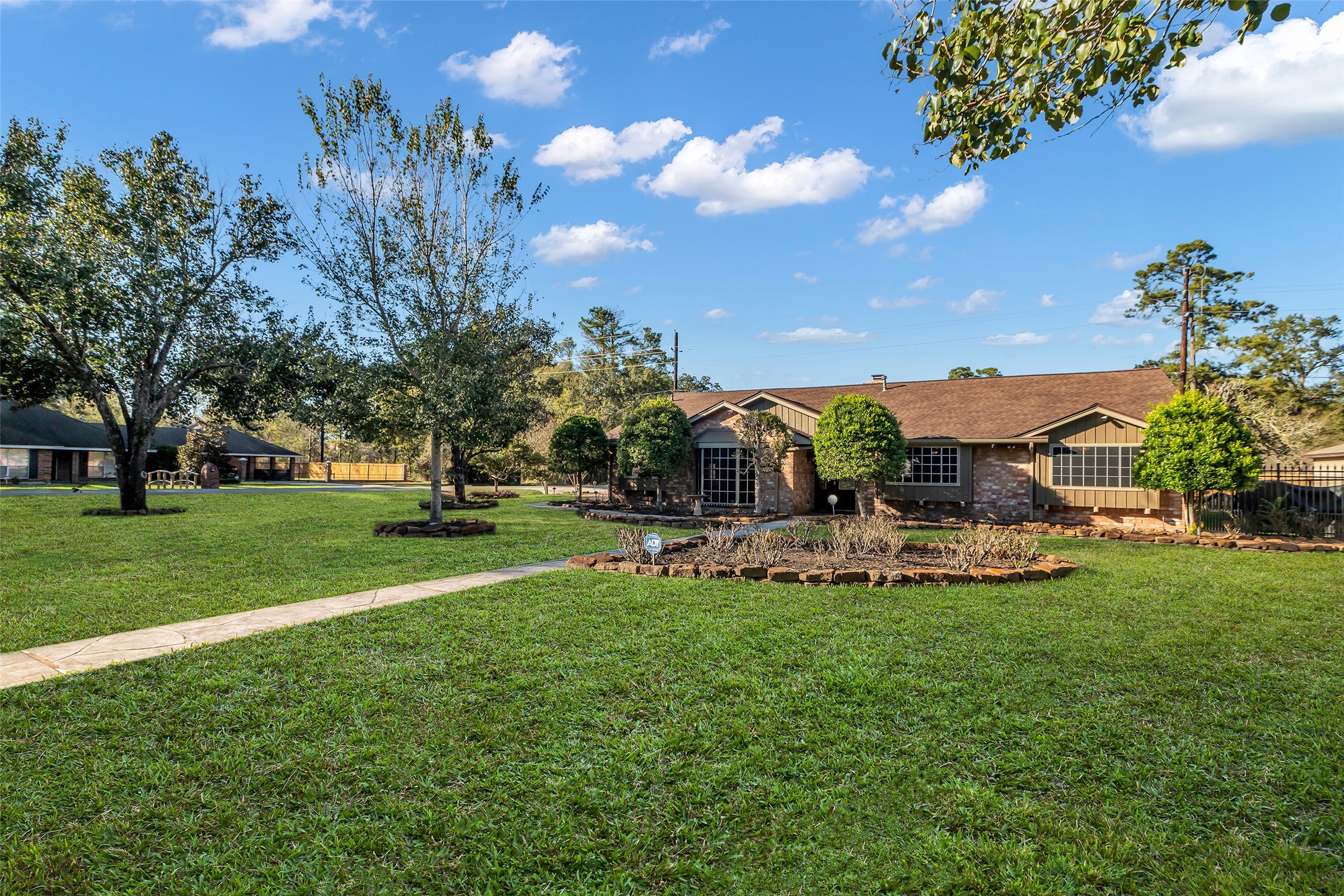 603 St Andrews Road Kingwood, TX 77339 - Photo 13 of 34 a view of a house with a yard and sitting area