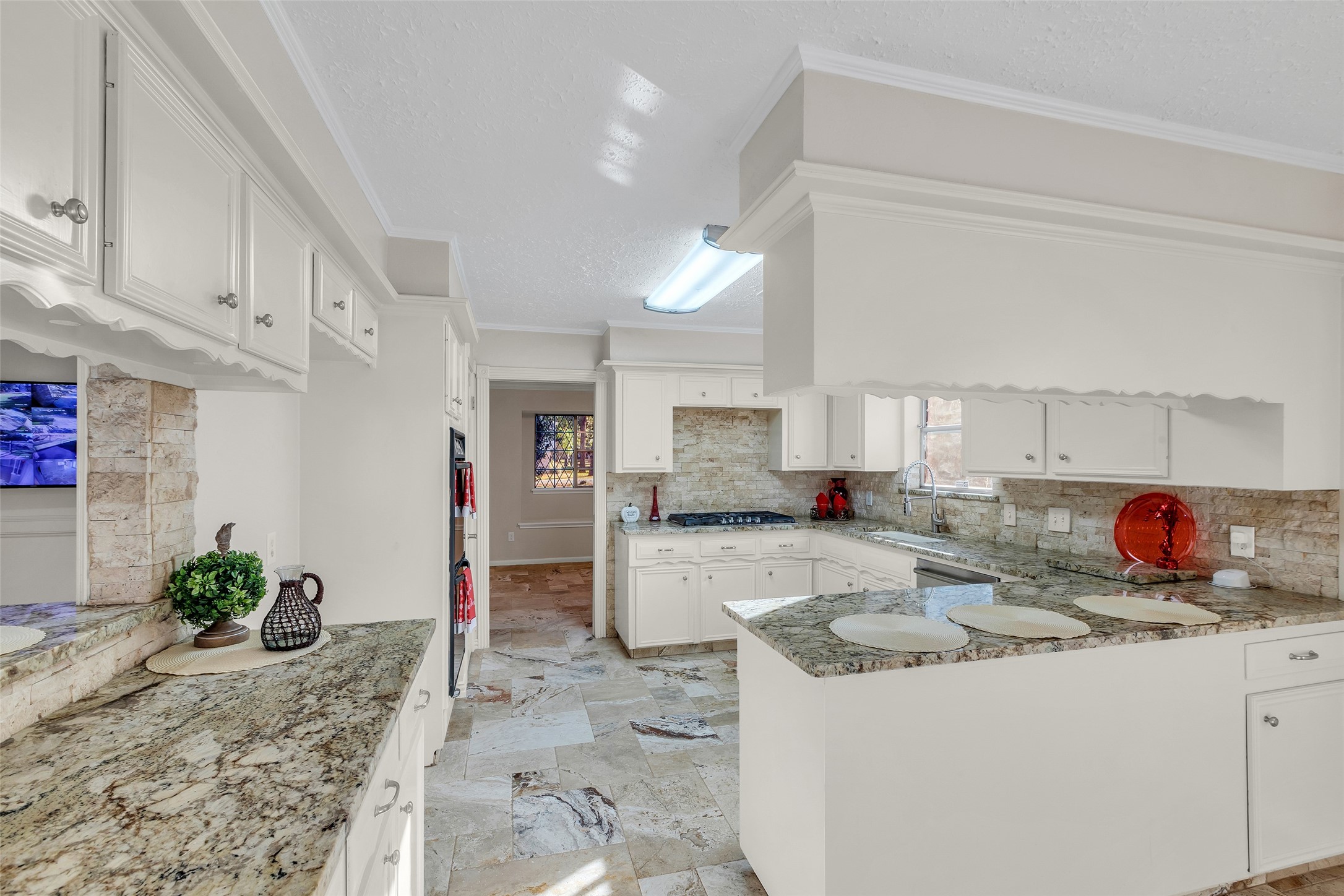603 St Andrews Road Kingwood, TX 77339 - Photo 15 of 34 a kitchen that has a lot of cabinets and refrigerator