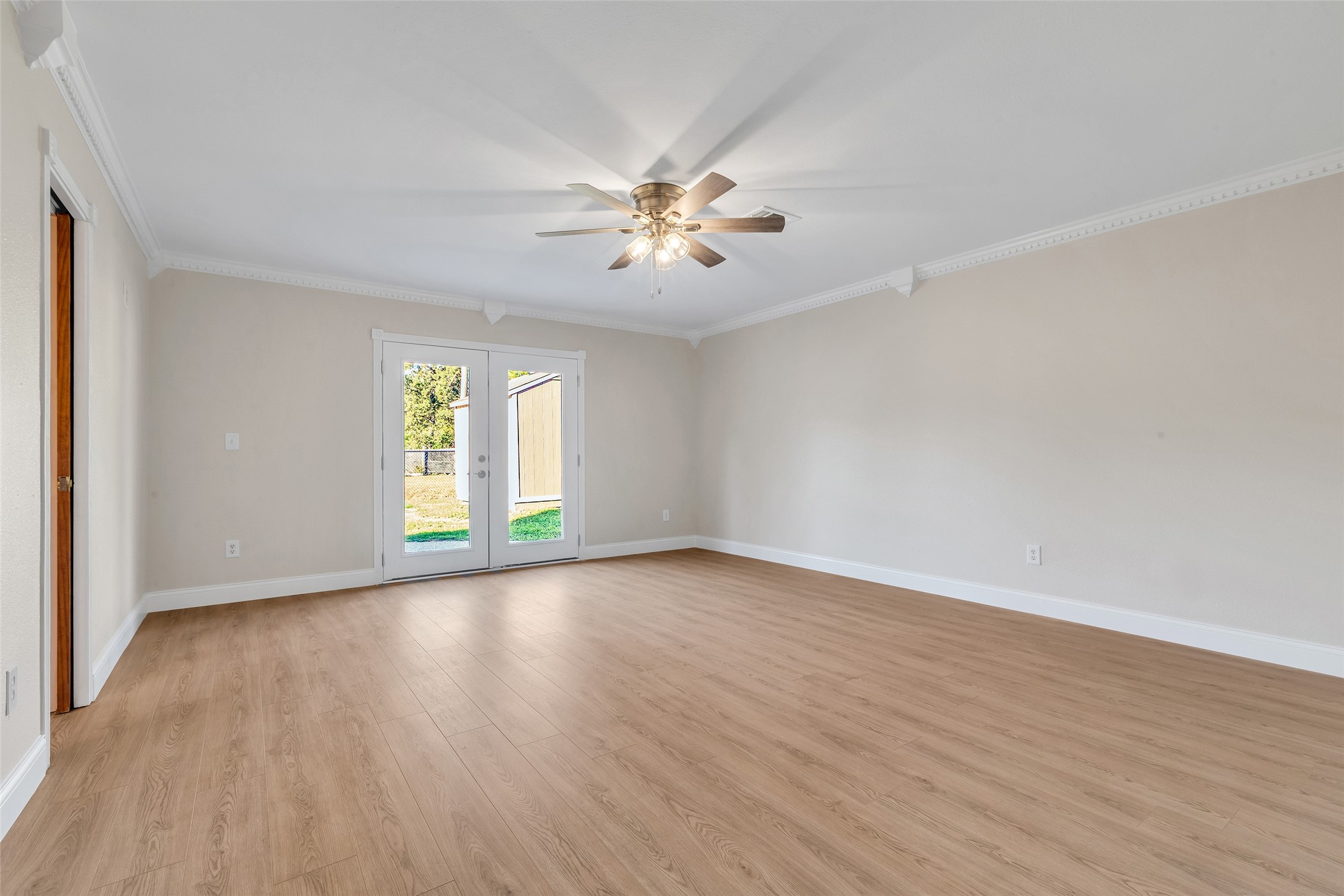603 St Andrews Road Kingwood, TX 77339 - Photo 20 of 34 an empty room with wooden floor and windows