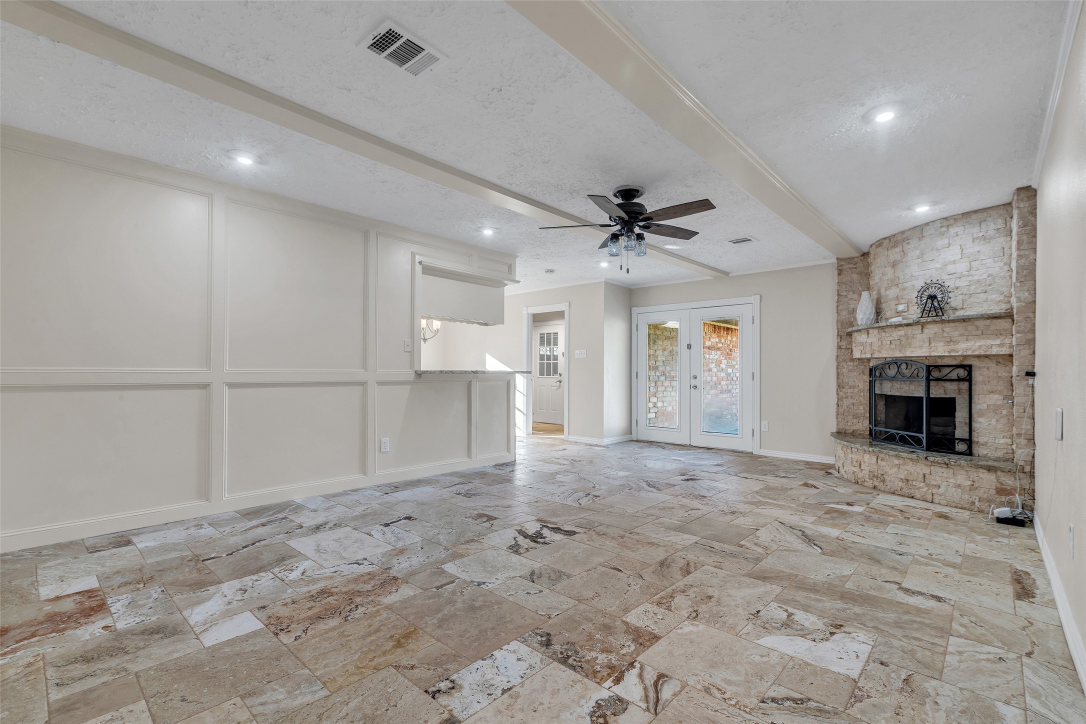 603 St Andrews Road Kingwood, TX 77339 - Photo 2 of 34 a view of a livingroom with a fireplace a ceiling fan and window
