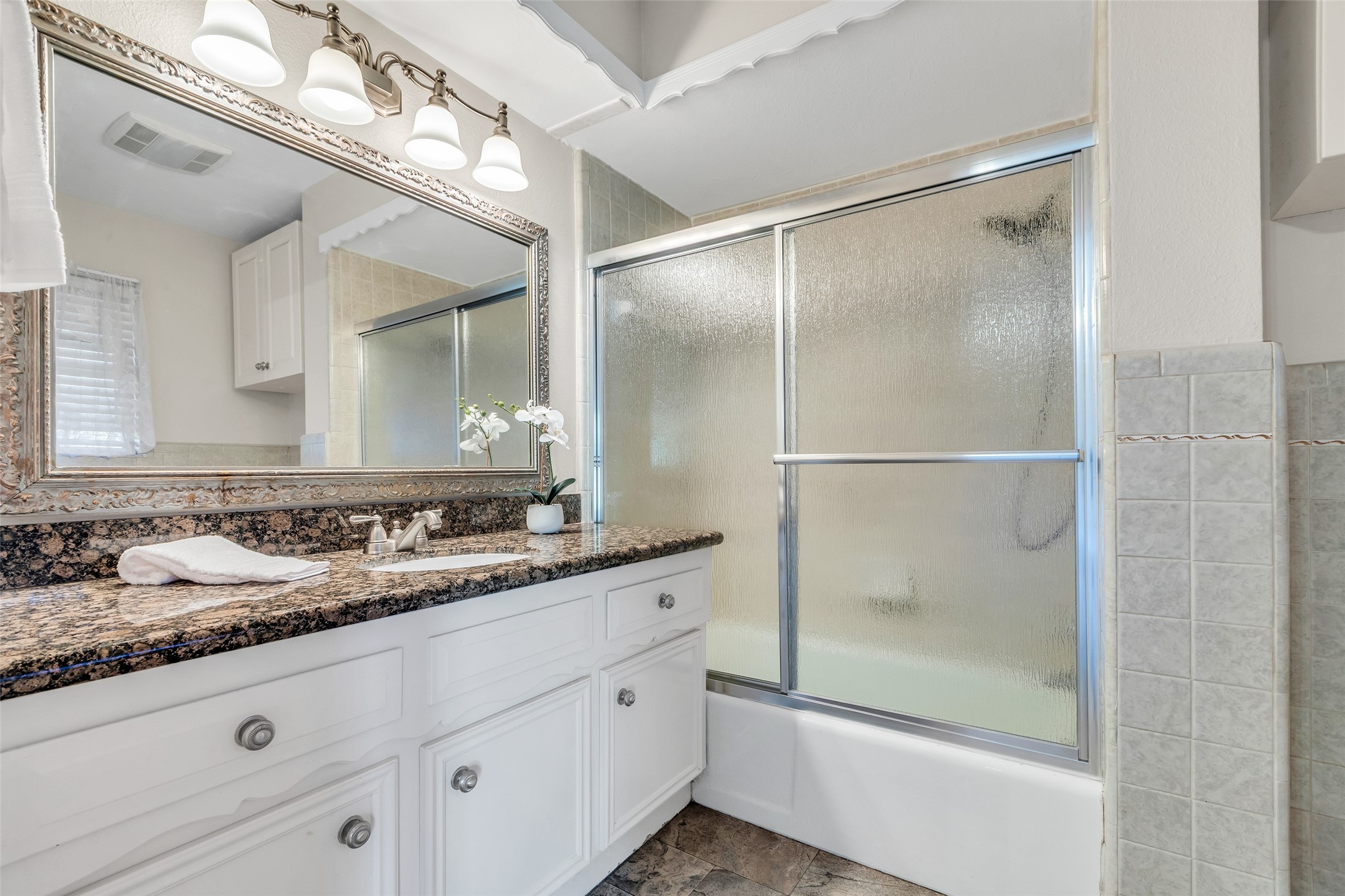 603 St Andrews Road Kingwood, TX 77339 - Photo 22 of 34 a bathroom with a granite countertop sink mirror and double