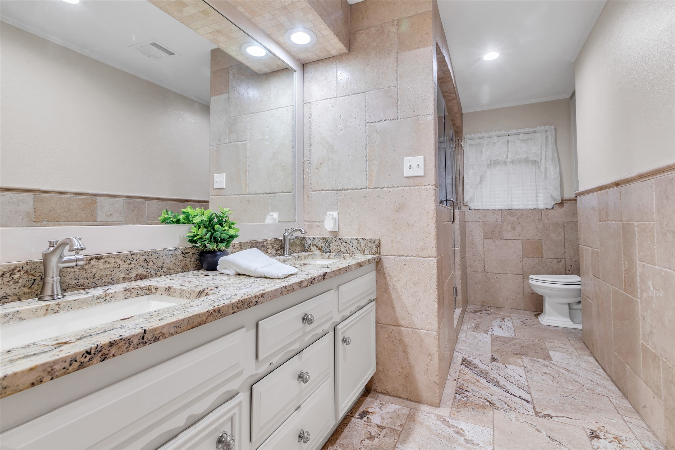 603 St Andrews Road Kingwood, TX 77339 - Photo 24 of 34 a bathroom with a granite countertop sink mirror and toilet