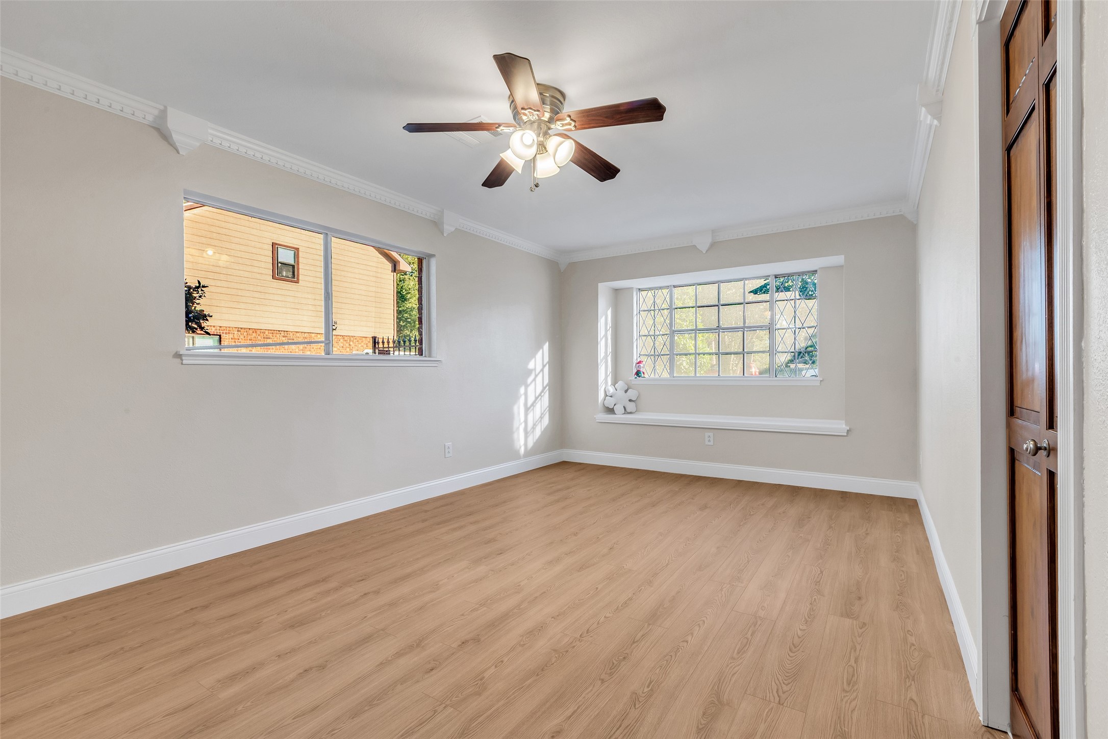 603 St Andrews Road Kingwood, TX 77339 - Photo 26 of 34 a view of an empty room with wooden floor and a window