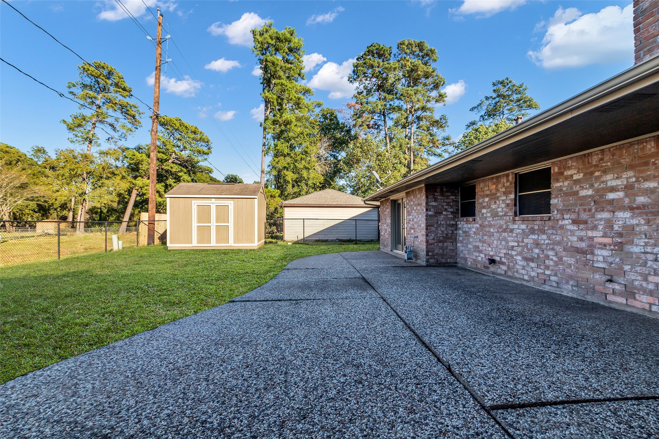 603 St Andrews Road Kingwood, TX 77339 - Photo 28 of 34 a front view of a house with a yard
