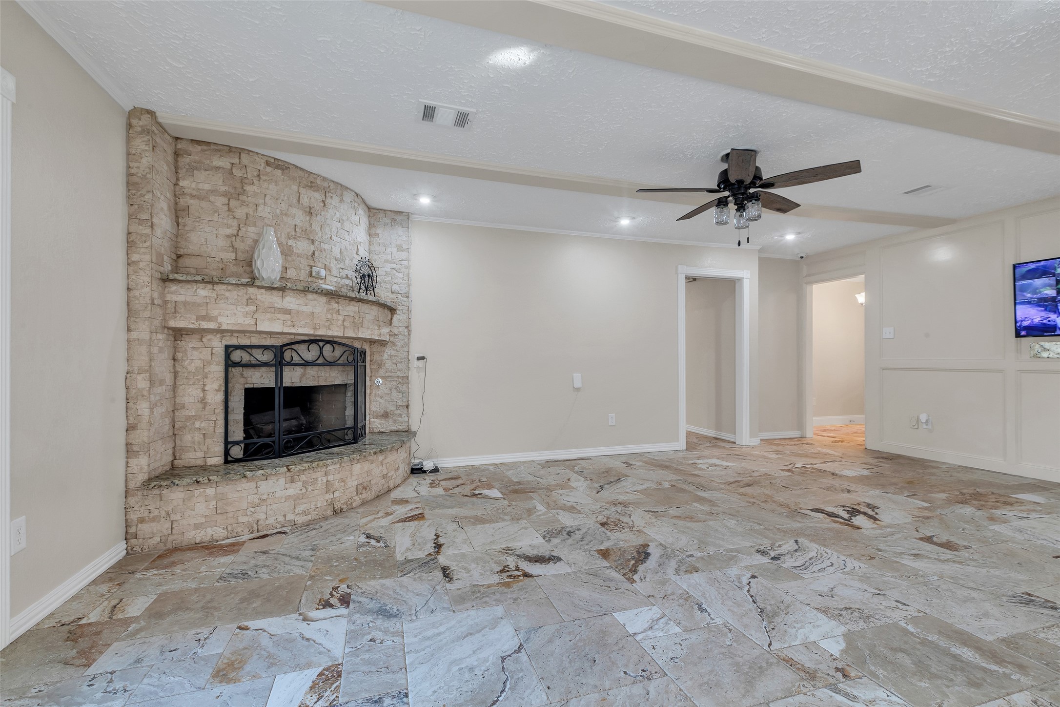 603 St Andrews Road Kingwood, TX 77339 - Photo 3 of 34 a view of a livingroom with a fireplace a ceiling fan and window