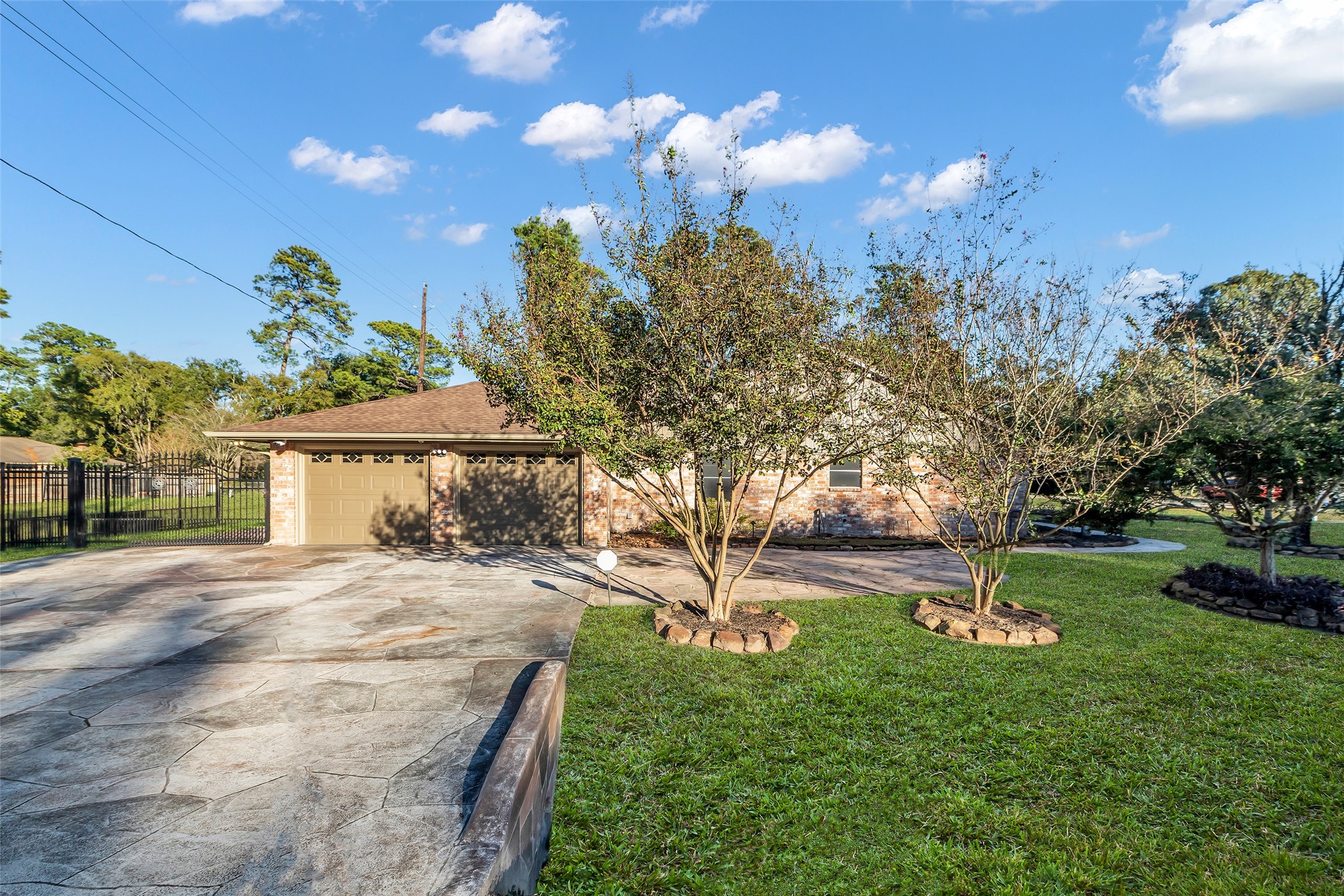 603 St Andrews Road Kingwood, TX 77339 - Photo 33 of 34 a front view of a house with a yard and tree s