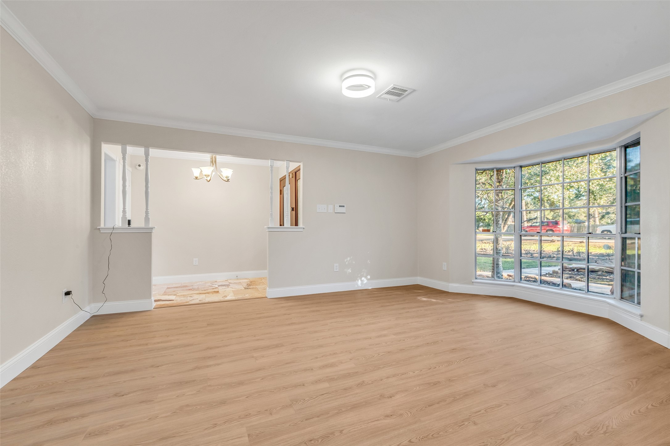 603 St Andrews Road Kingwood, TX 77339 - Photo 7 of 34 wooden floor in an empty room with a window