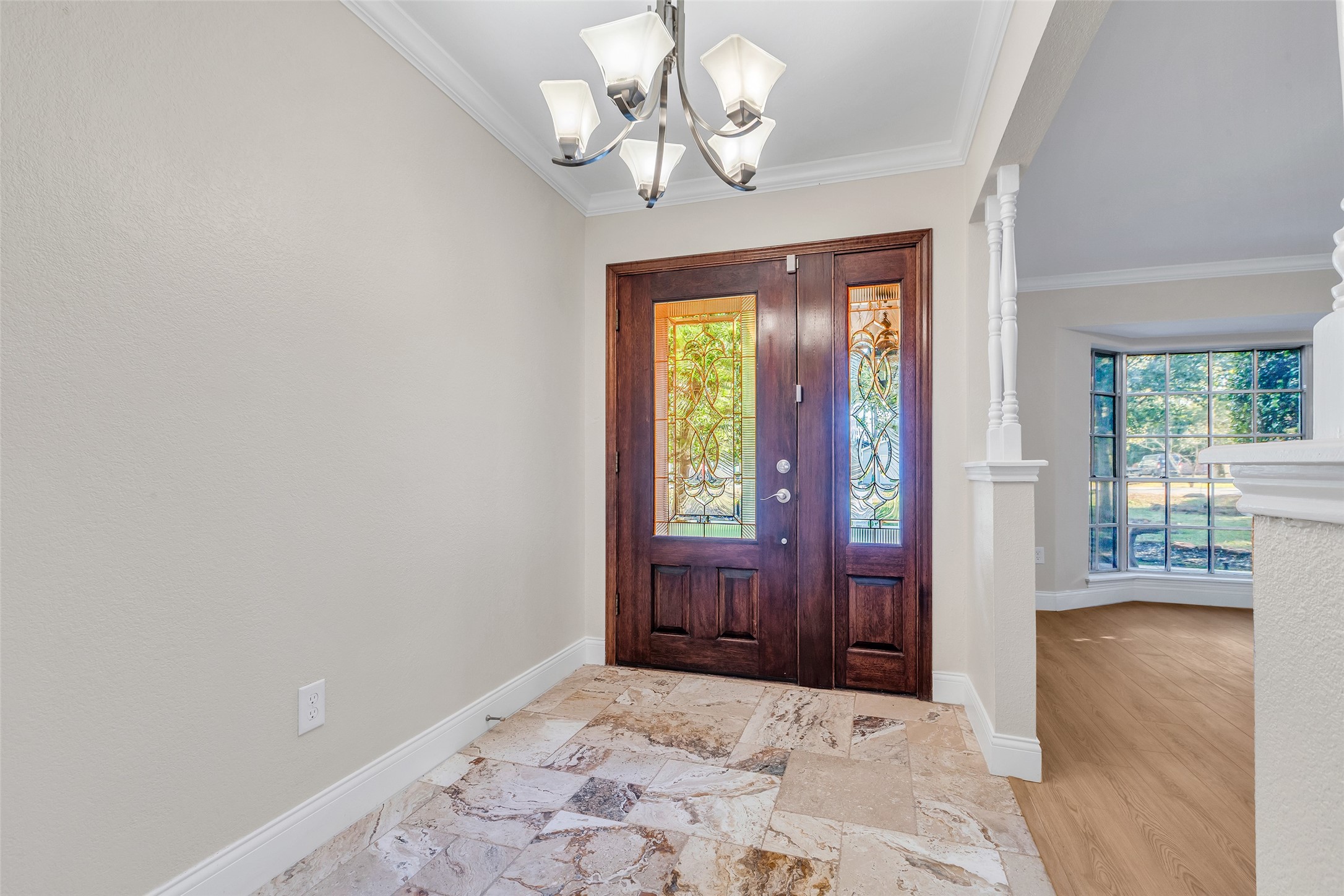 603 St Andrews Road Kingwood, TX 77339 - Photo 8 of 34 a view of a chandelier fan and wooden floor in a room