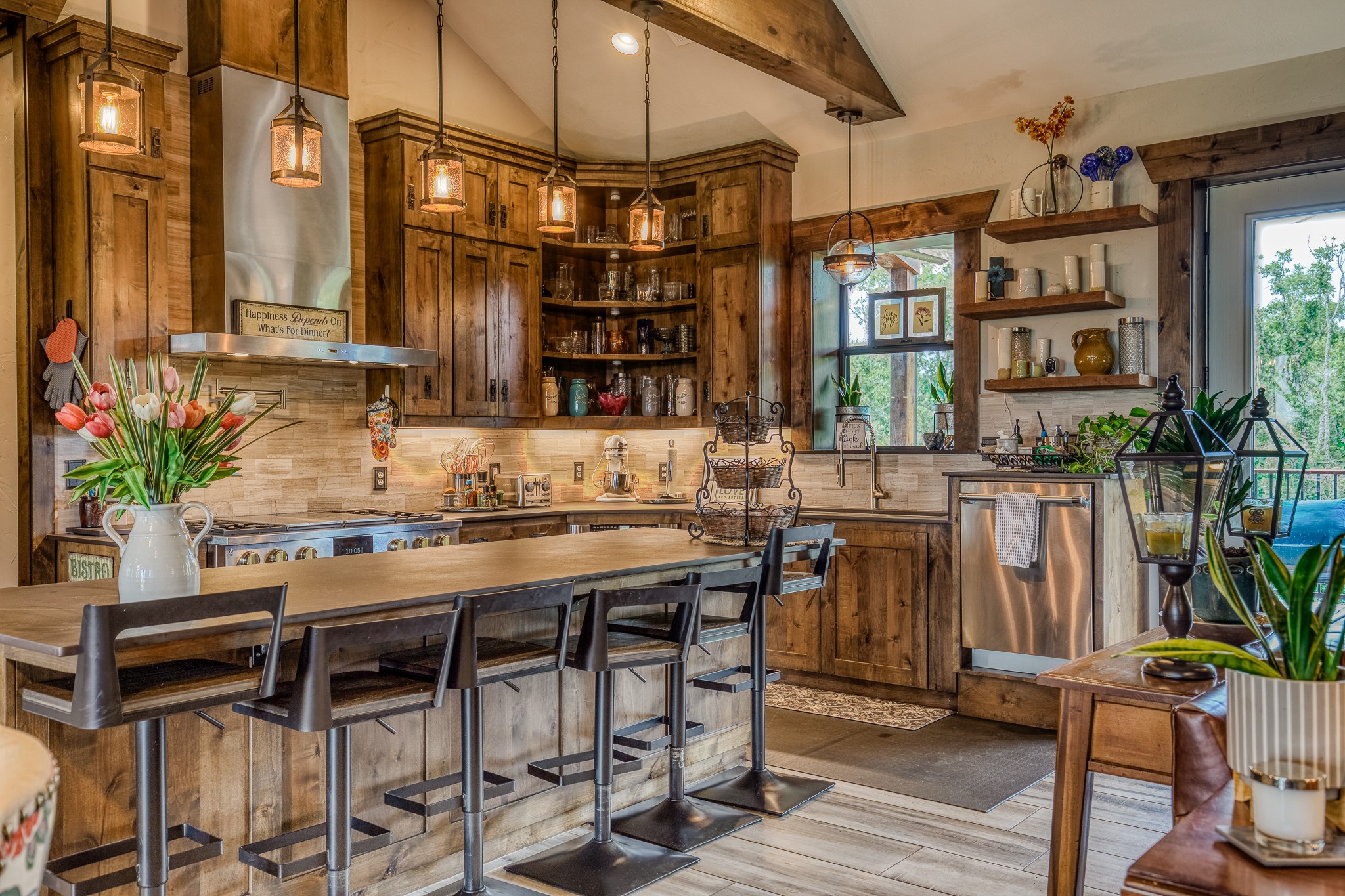 10092 County Road 446 Somerville, TX 77879 - Photo 12 of 50 a kitchen with a sink a table and chairs in it