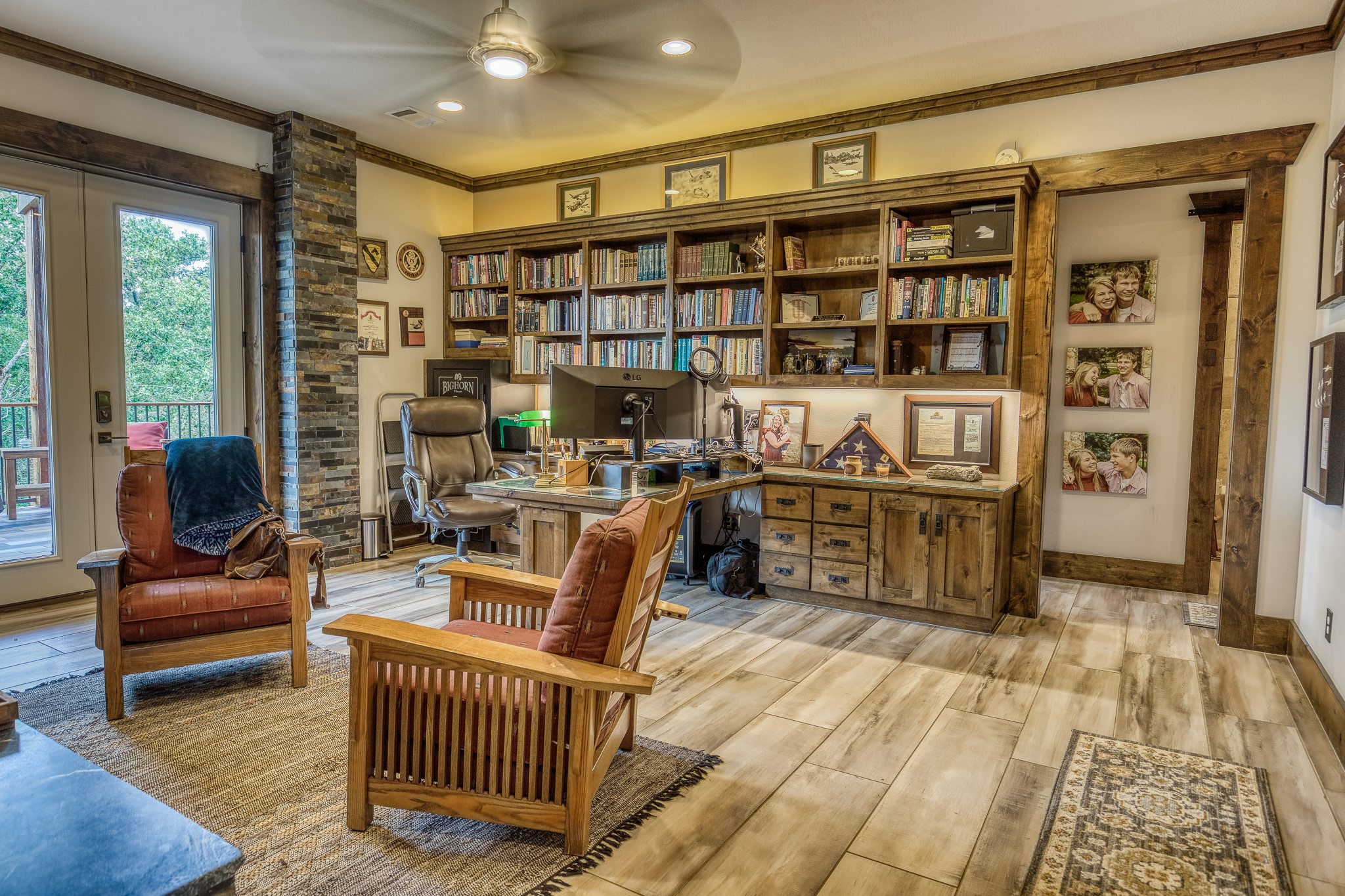 10092 County Road 446 Somerville, TX 77879 - Photo 15 of 50 a living room with furniture a rug and a book shelf