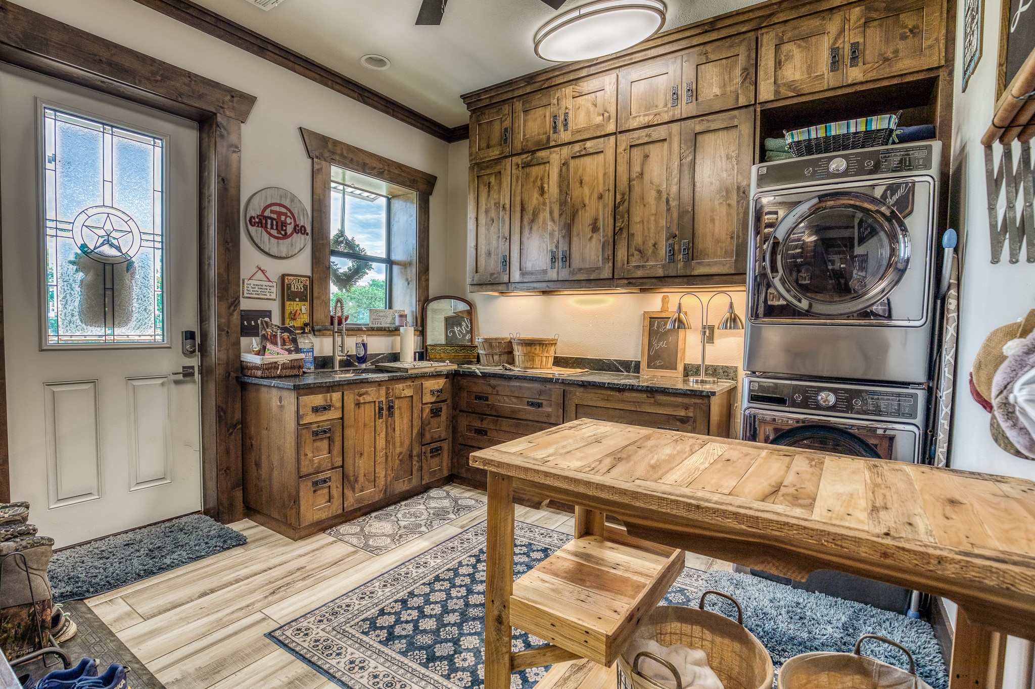 10092 County Road 446 Somerville, TX 77879 - Photo 16 of 50 a kitchen with a refrigerator a stove and a sink with wooden floor