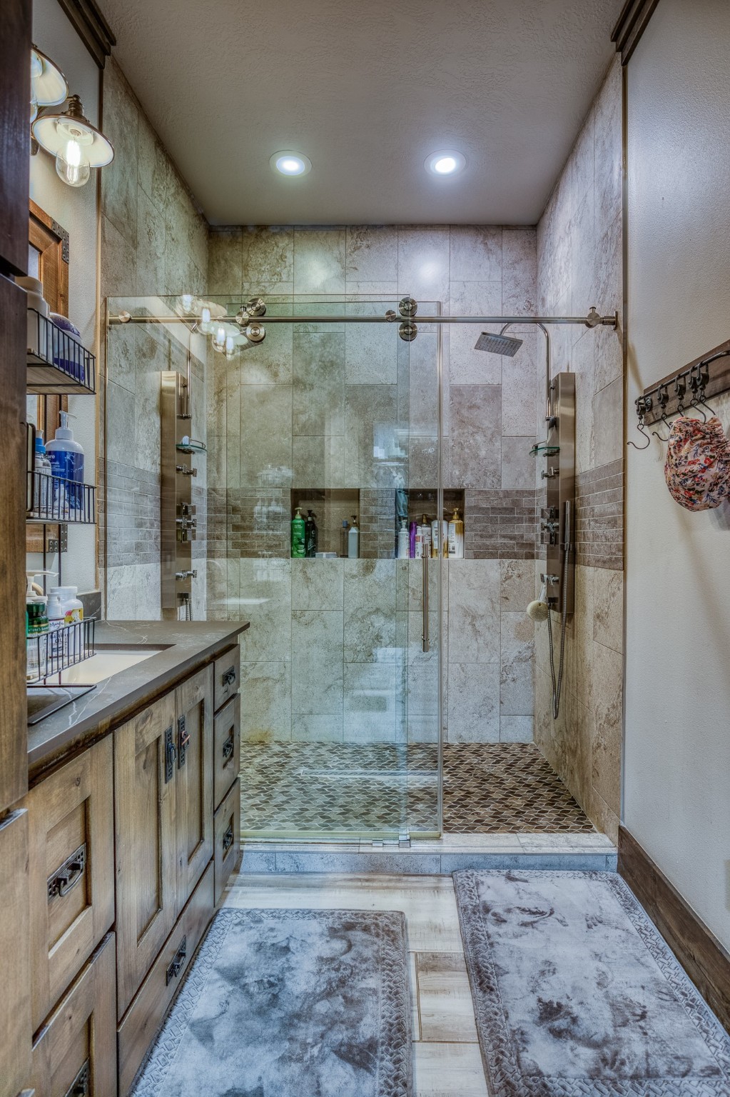 10092 County Road 446 Somerville, TX 77879 - Photo 20 of 50 a bathroom with a granite countertop sink a toilet and shower