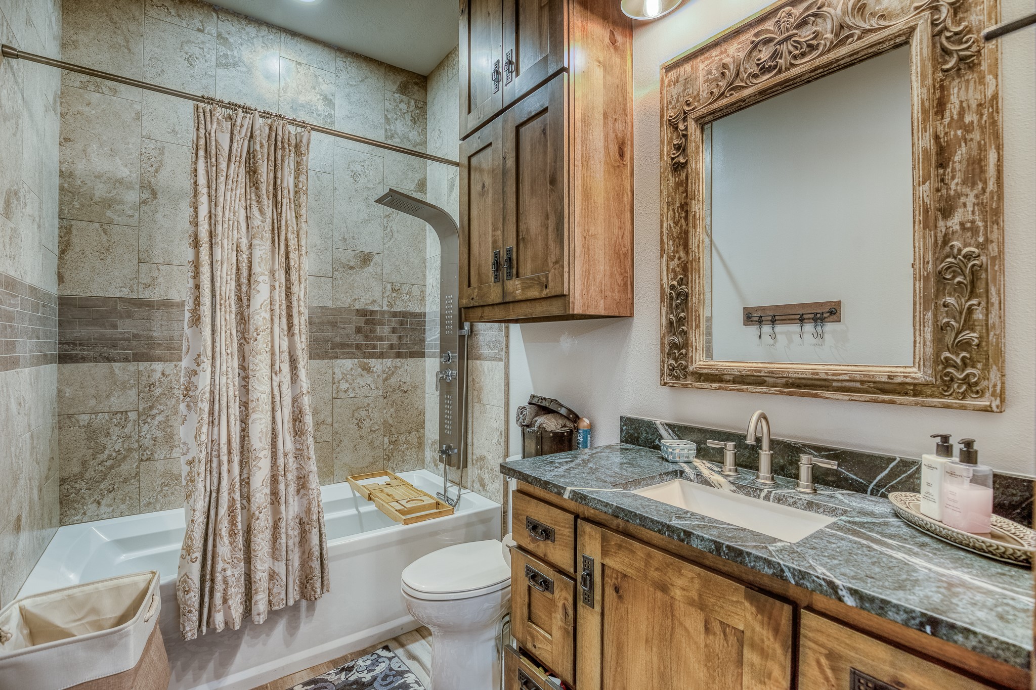 10092 County Road 446 Somerville, TX 77879 - Photo 22 of 50 a bathroom with a granite countertop sink toilet and shower